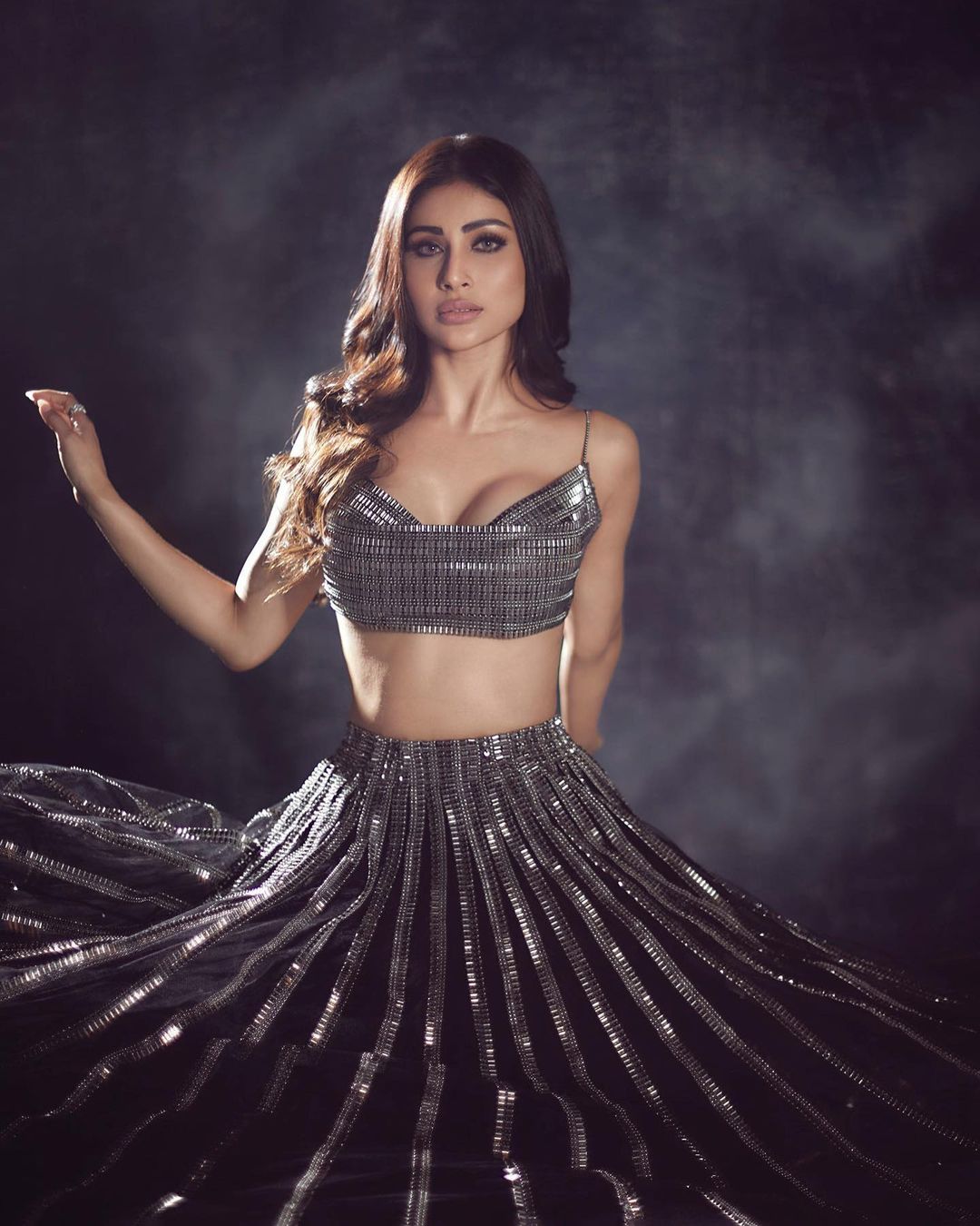 Mouni Roy looks goegrous as she flaunts her perfectly toned body in this sequinned lehenga