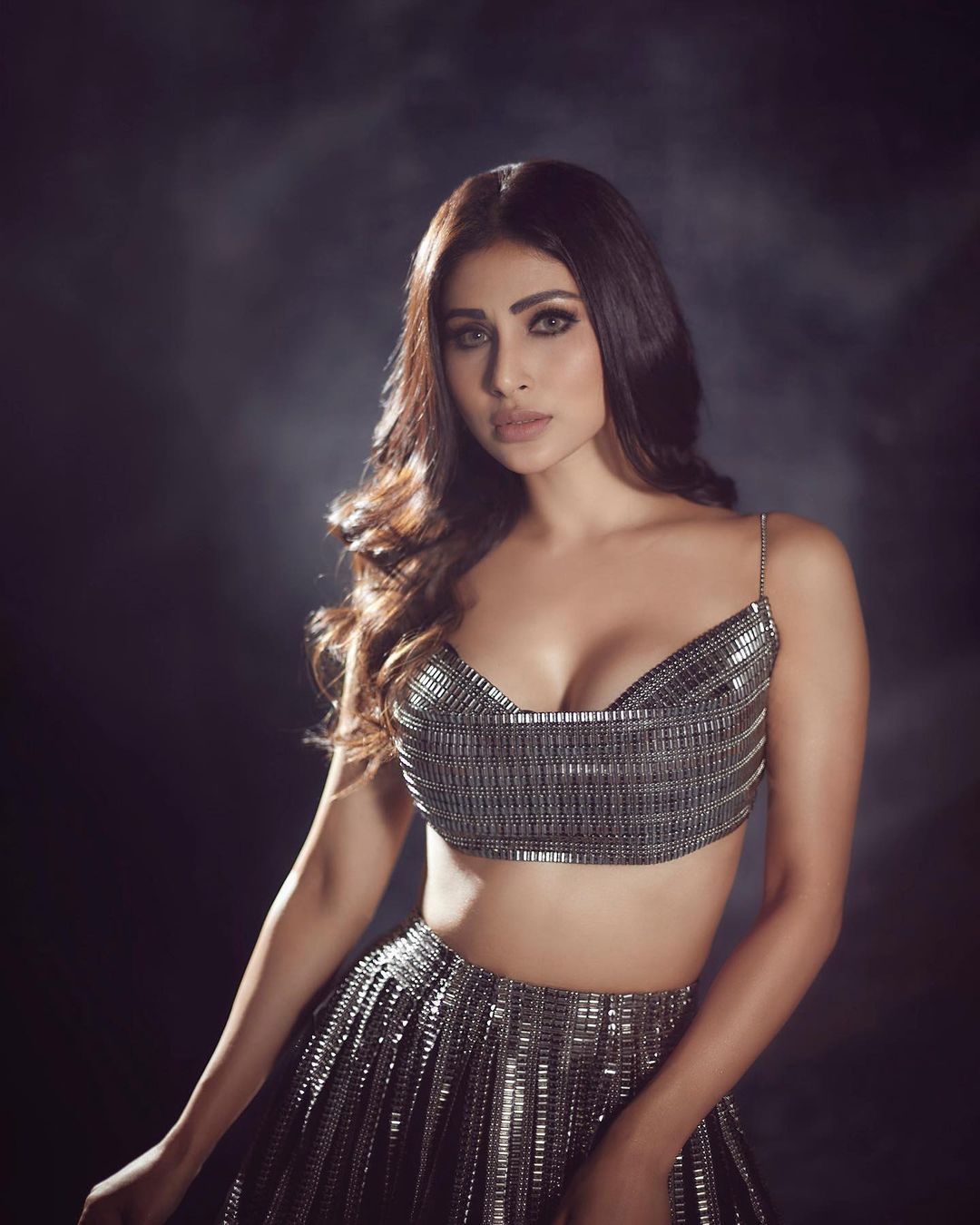 The Gold actress looks hotness overload as she poses for the lens in a tight fitted cleavage baring sequinned choli