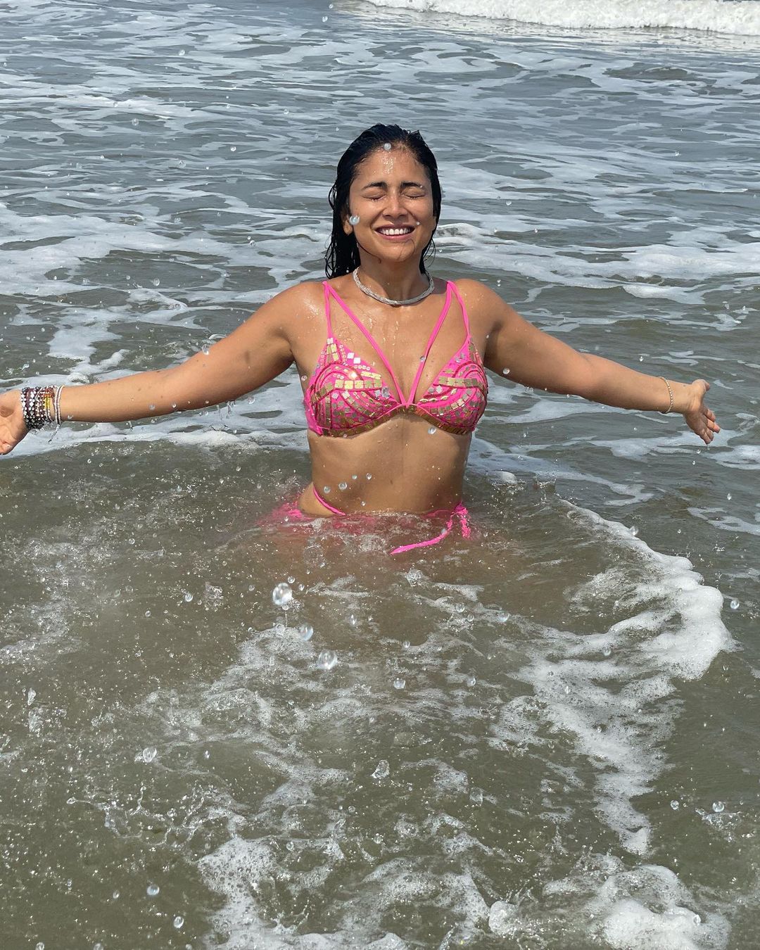 Shriya Saran is beating the summer heat in a pink sparkling bikini.