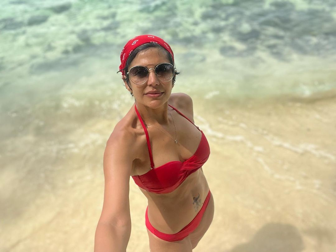 Mandira Bedi pairs the bikini with a red bandana