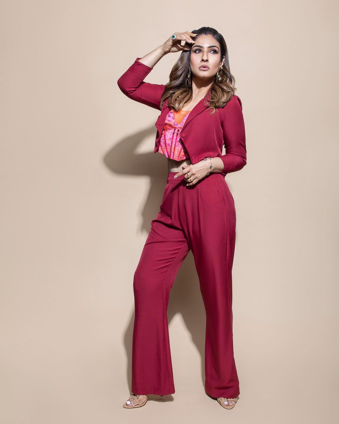 Raveena Tandon strikes a pose in the maroon suit