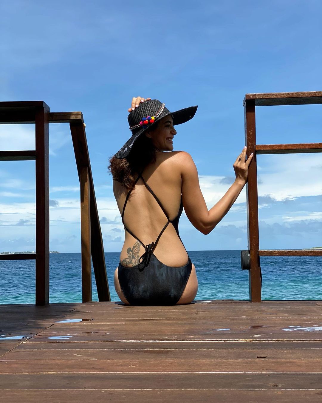 Karishma Tanna displays her toned back in the black swimwear