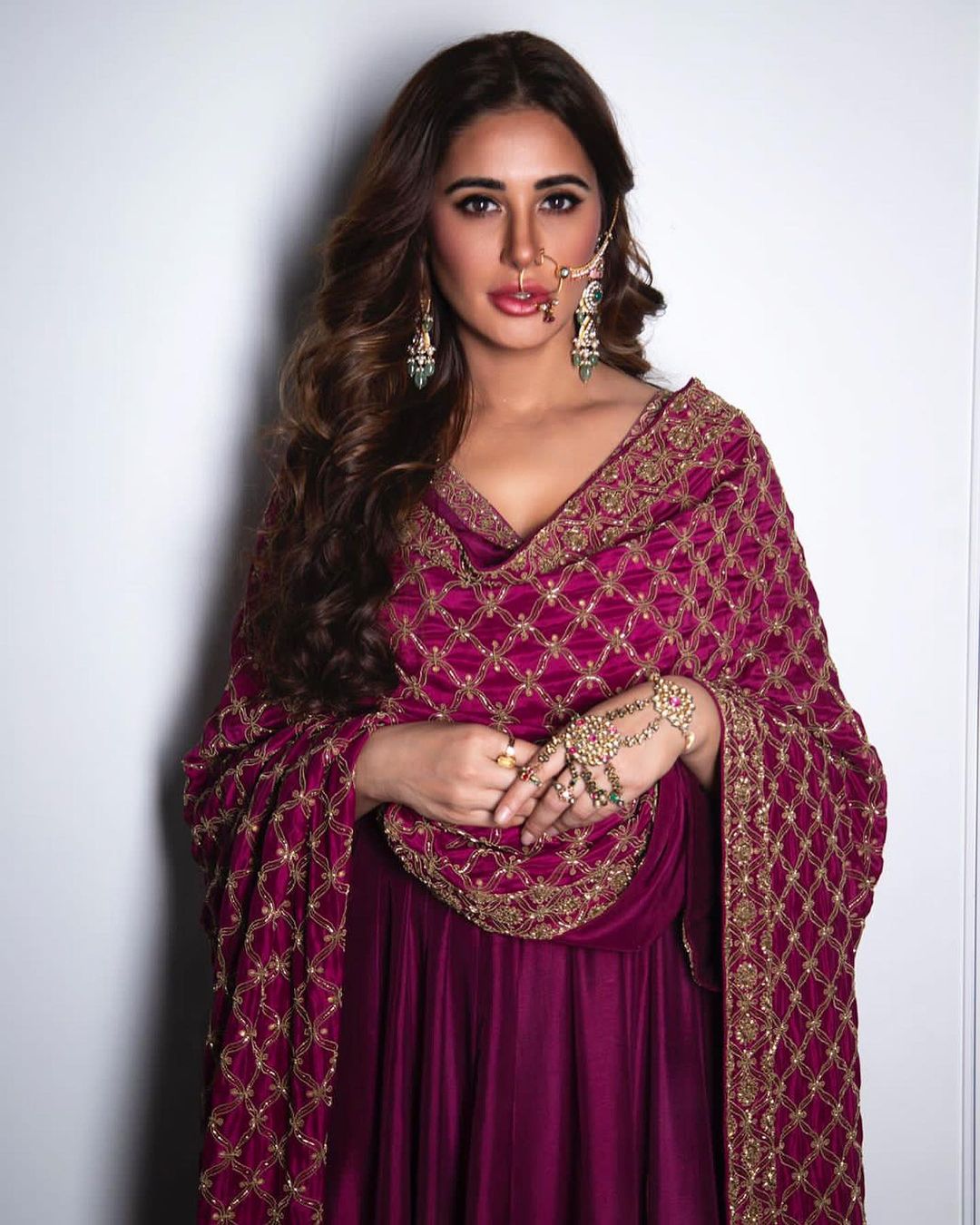 Nargis Fakhri looks elegant in the purple kurta and dupatta