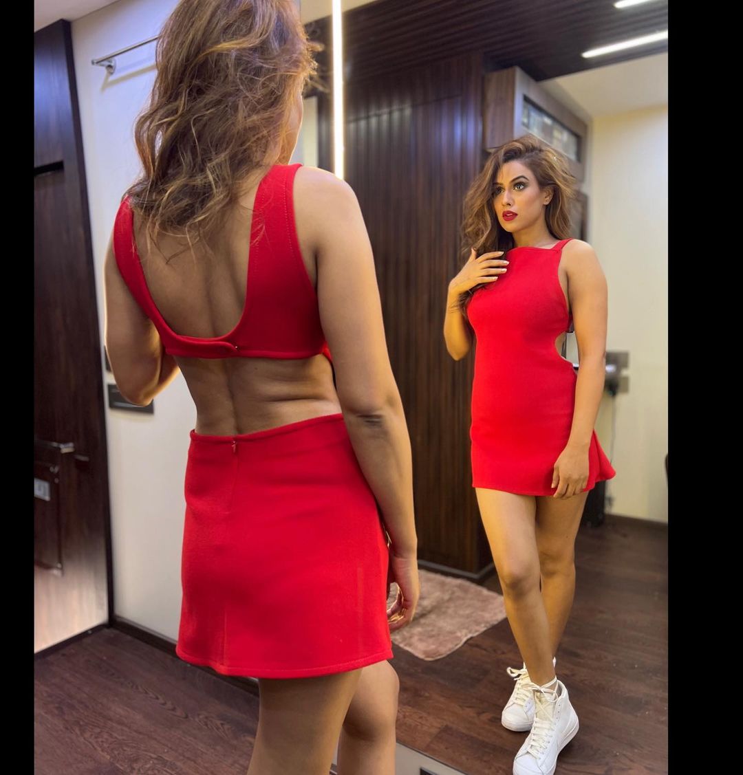 Nia Sharma flaunts her toned body in the racy red mini