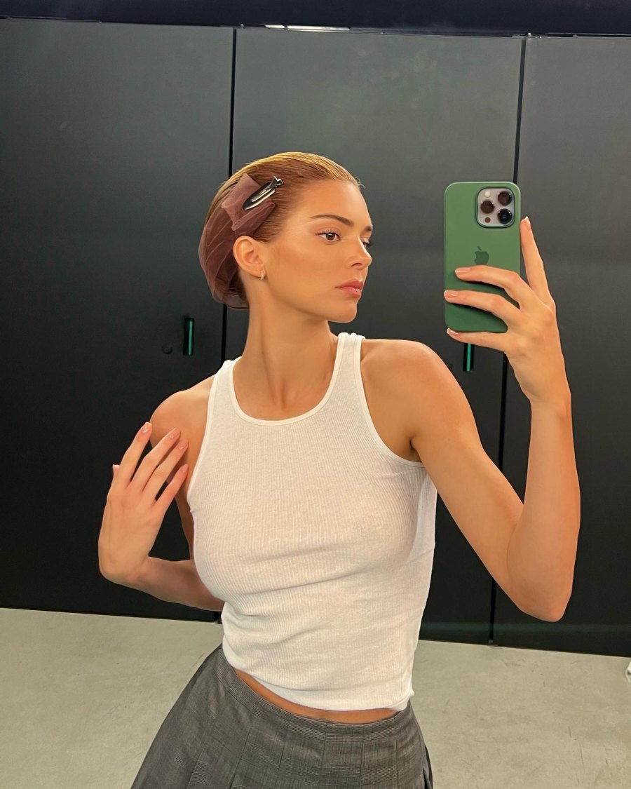 Kendall rocked a see-through white tank top in a mirror selfie during Milan Fashion Week