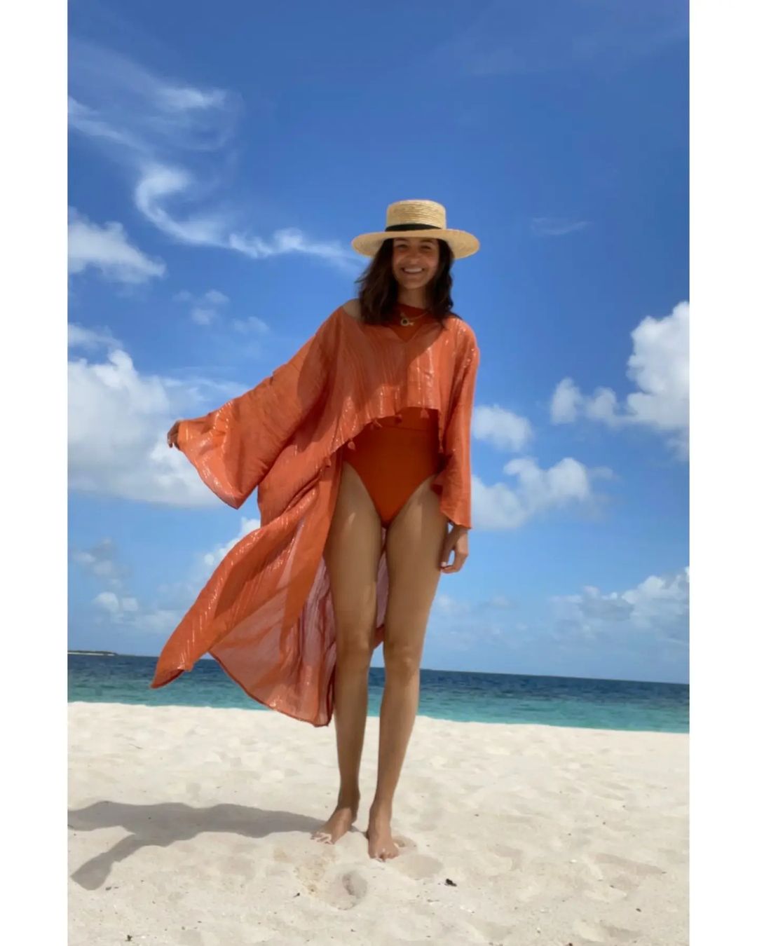 Anushka Sharma is oozing oomph in an orange monokini as she holidays in Maldives with her family.