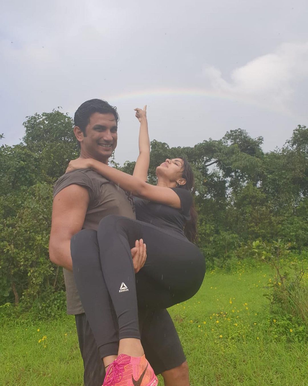 Sushant Singh Rajput holds Rhea Chakraborty in his arms.