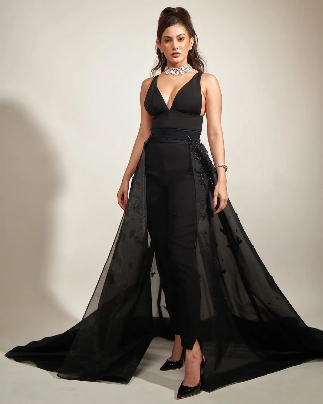 Amyra Dastur cuts a statusque figure in the black jumpsuit with the voluptuous train