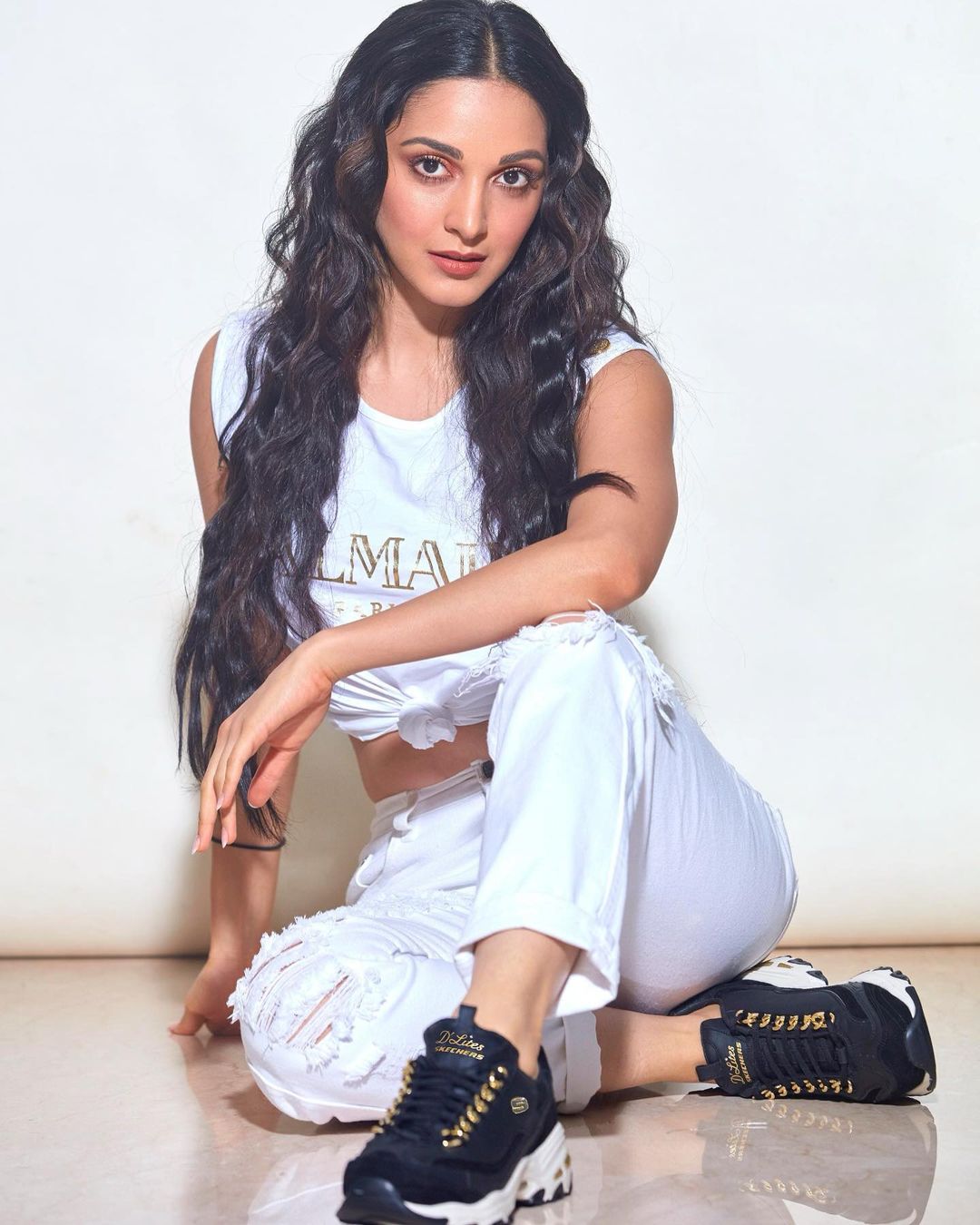 Kiara Advani looks smart in the white tee and matching distressed jeans