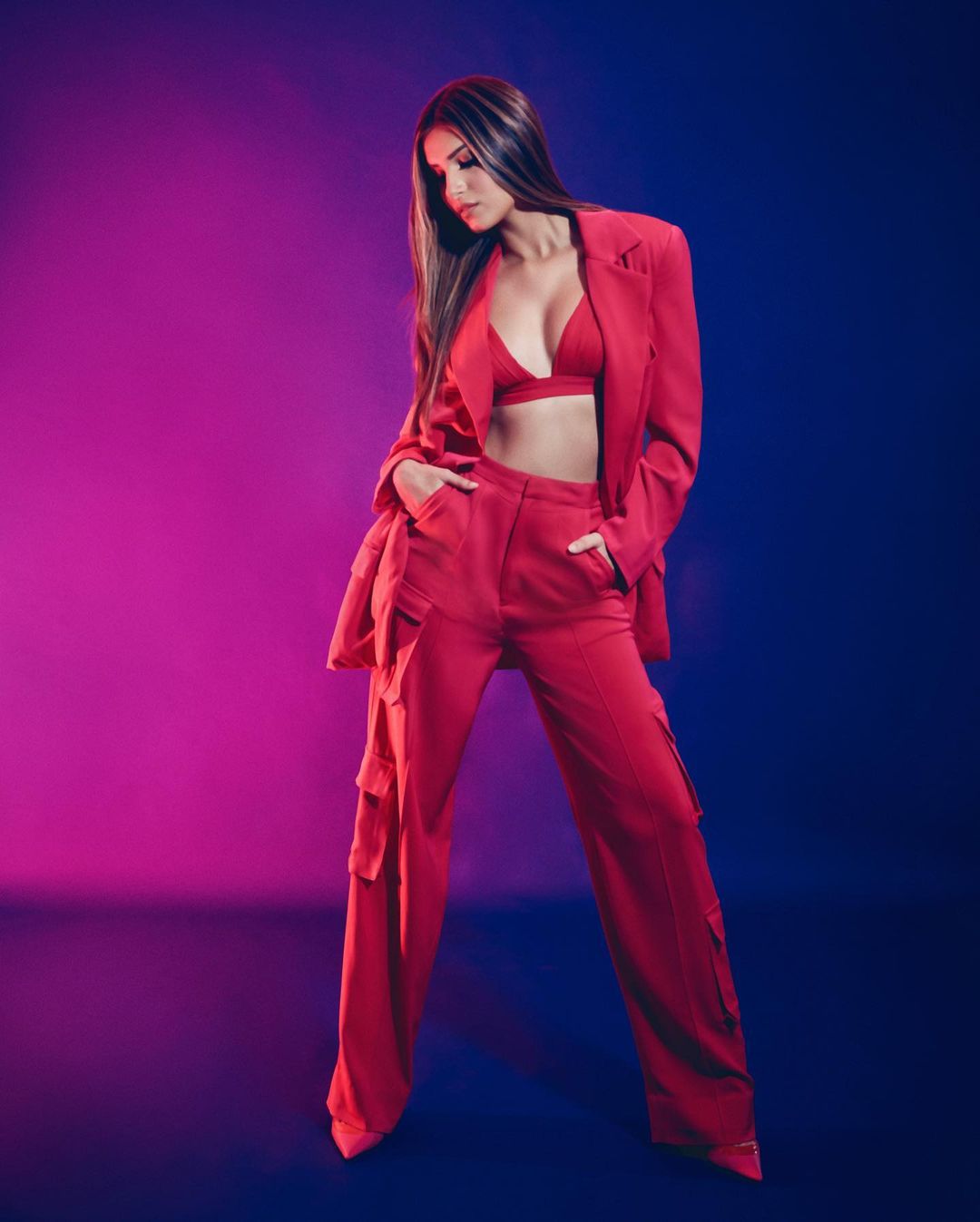 Tara Sutaria looks chic in the red pantsuit.