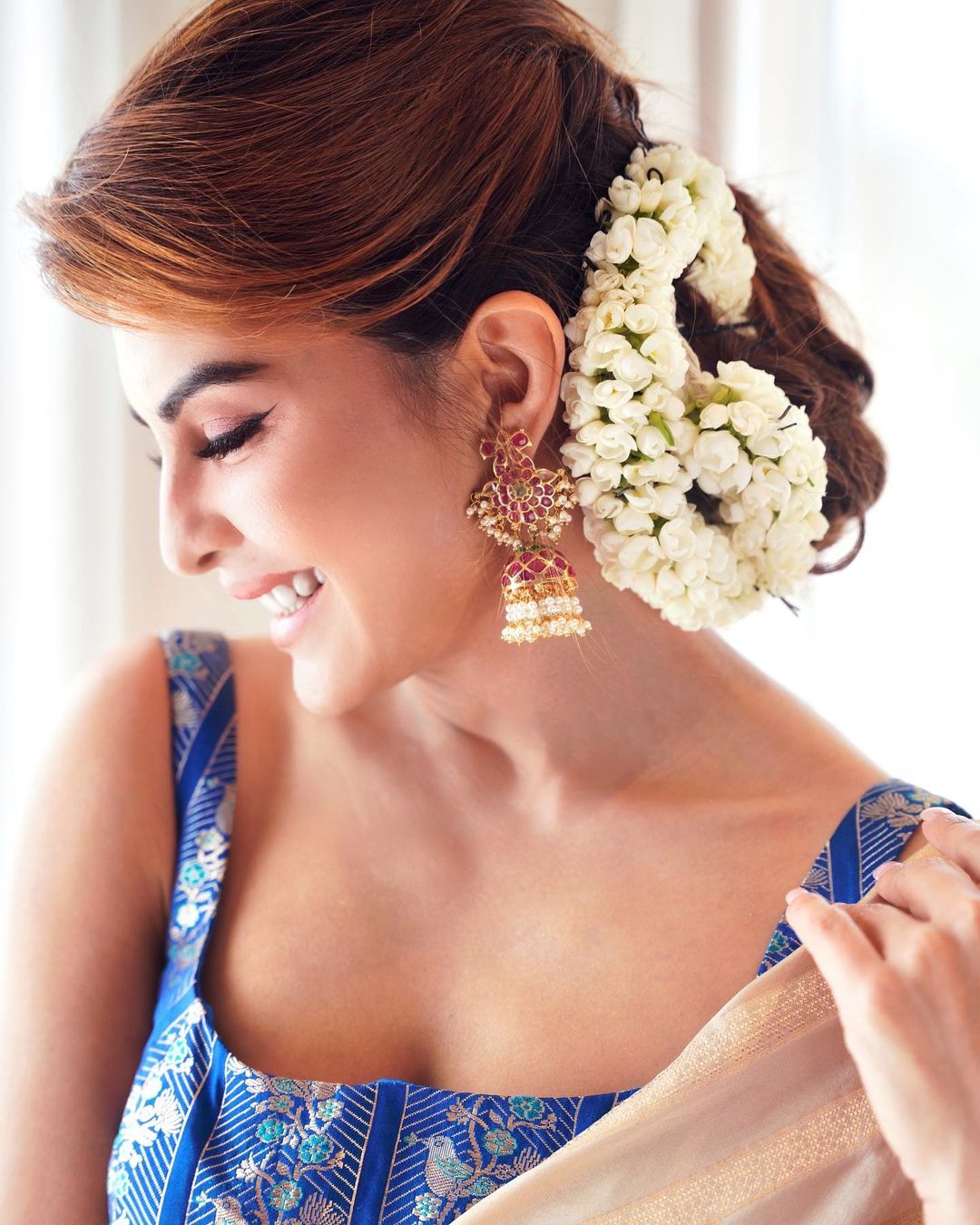 Jacqueline Fernandez stuns with the fresh flowers adorning her hair and traditional jhumkas