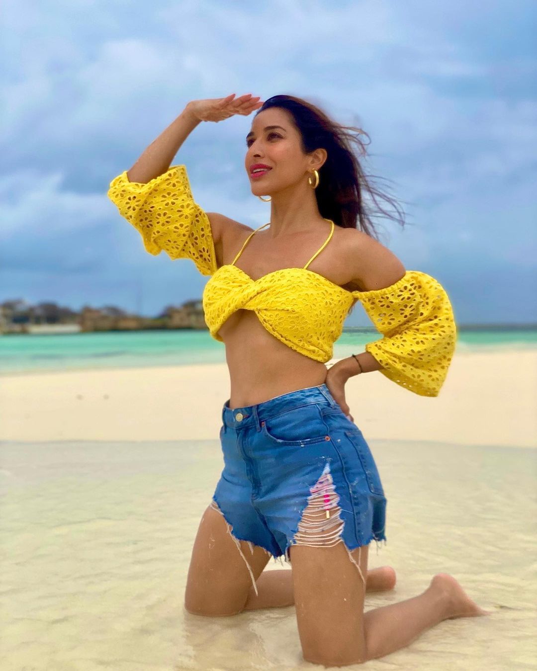Sophie Choudry looks stunning in the yellow crop top and denim shorts