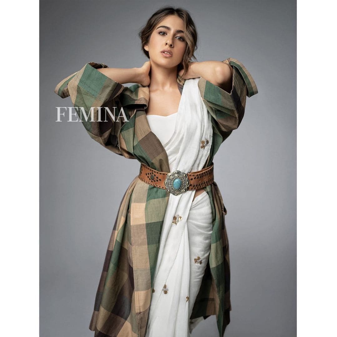 Sara Ali Khan looks elegant in the white cotton saree with a checkered oversized shirt.