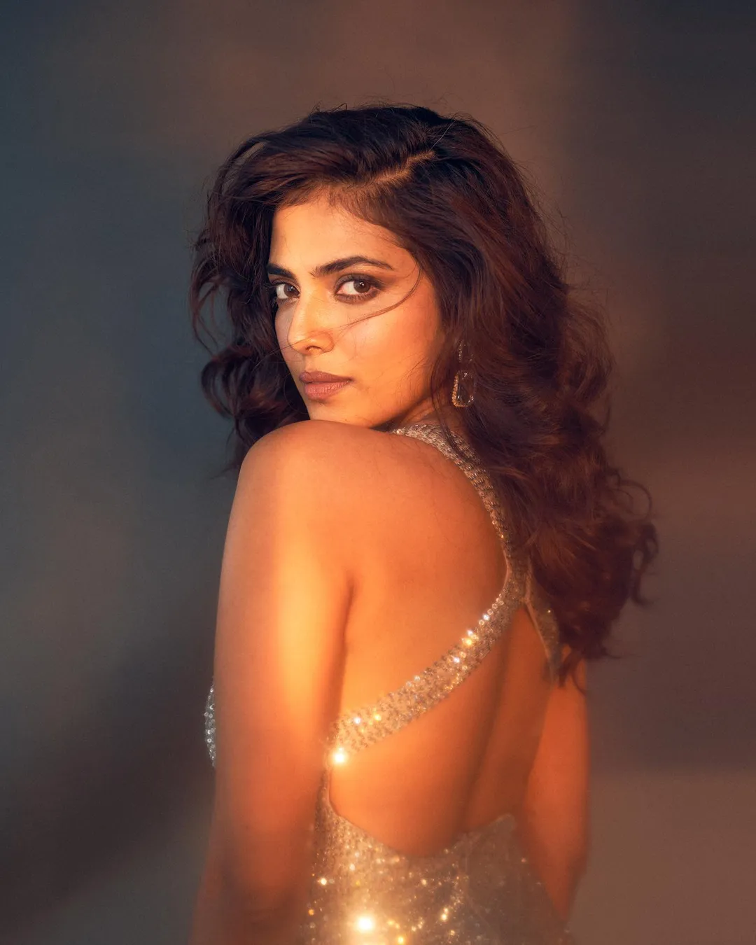 Vijay's Master co-star  Malavika Mohanan looks fiery hot in a short shimmery plunging neckline dress with a high slit