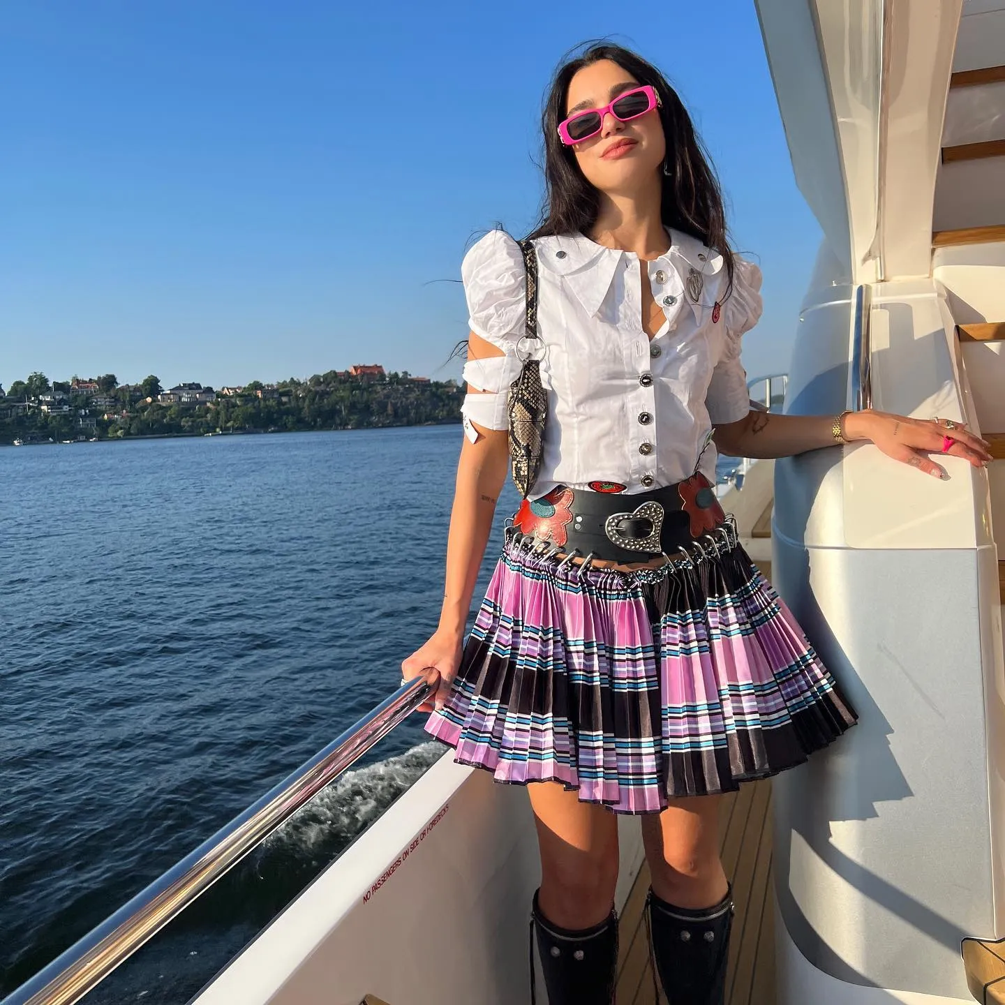Dua Lipa Emulates the Punk Schoolgirl Aesthetic on a Yacht