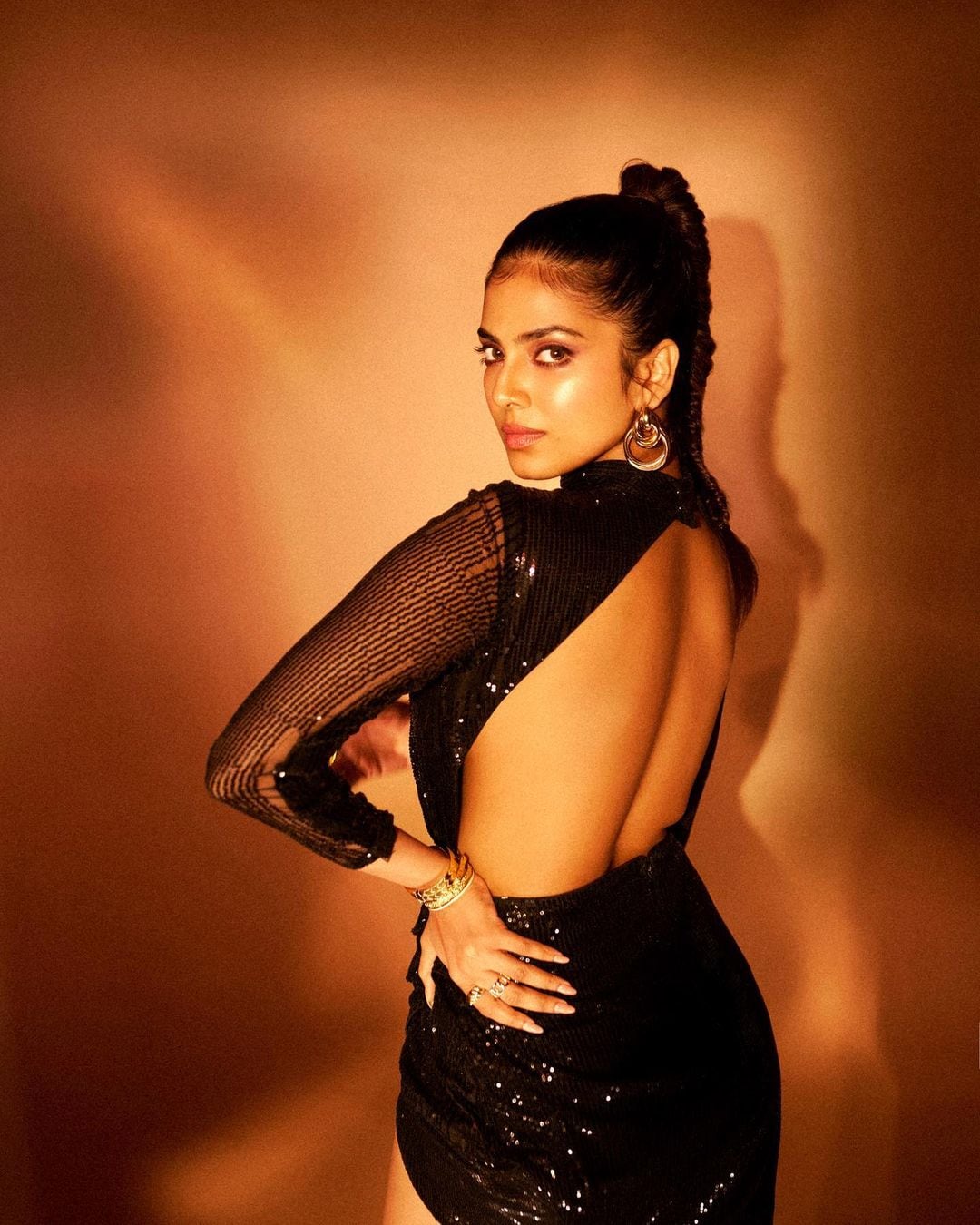 Malavika Mohanan is flaunting her curves in a sexy black backless dress.