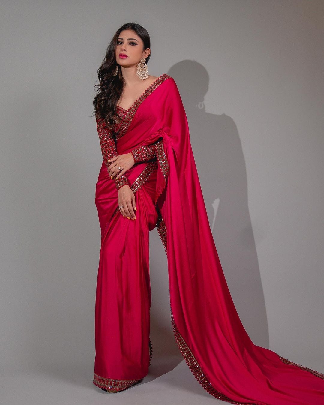 Mouni Roy looks breathtaking in a deep red saree