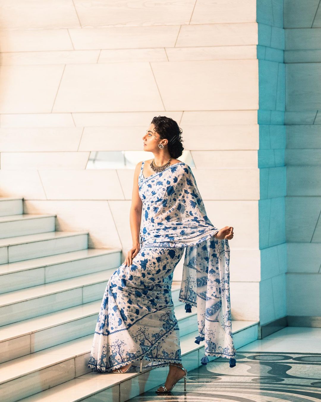 Taapsee Pannu is a sight to behold in a white and blue floral saree
