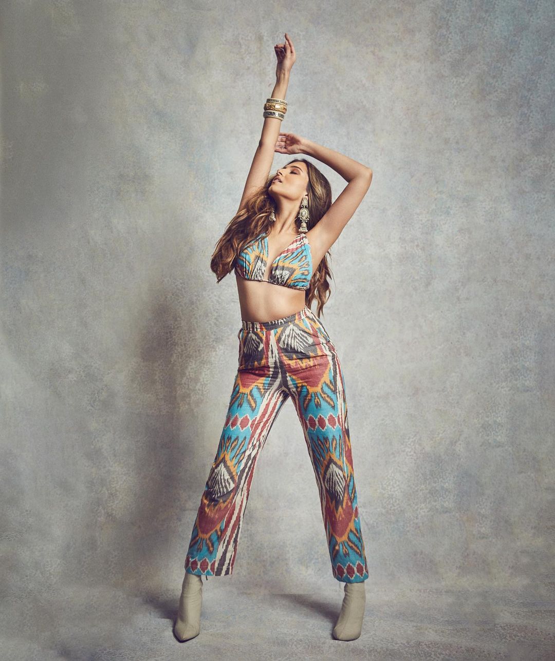 Tara Sutaria looks sexy in the colourful printed bralette and pants.