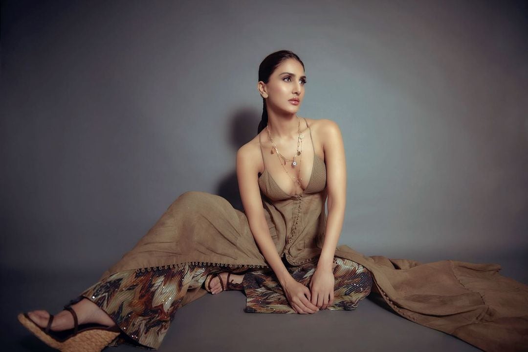 Vaani Kapoor is raising temperatures in a cleavage-baring nude-coloured outfit.