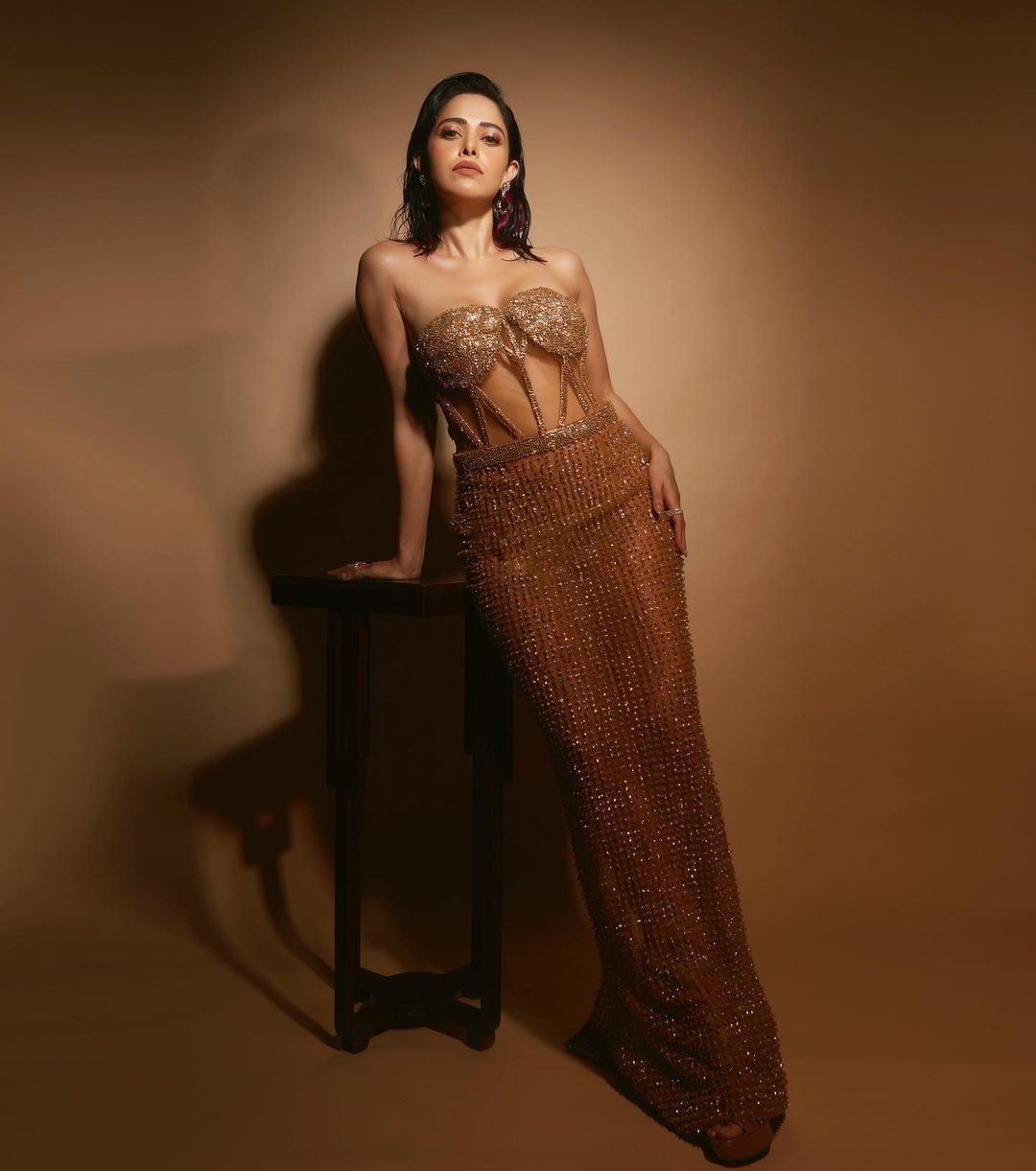 Nushrratt Bharuccha raises temperature in a golden shimmering dress.