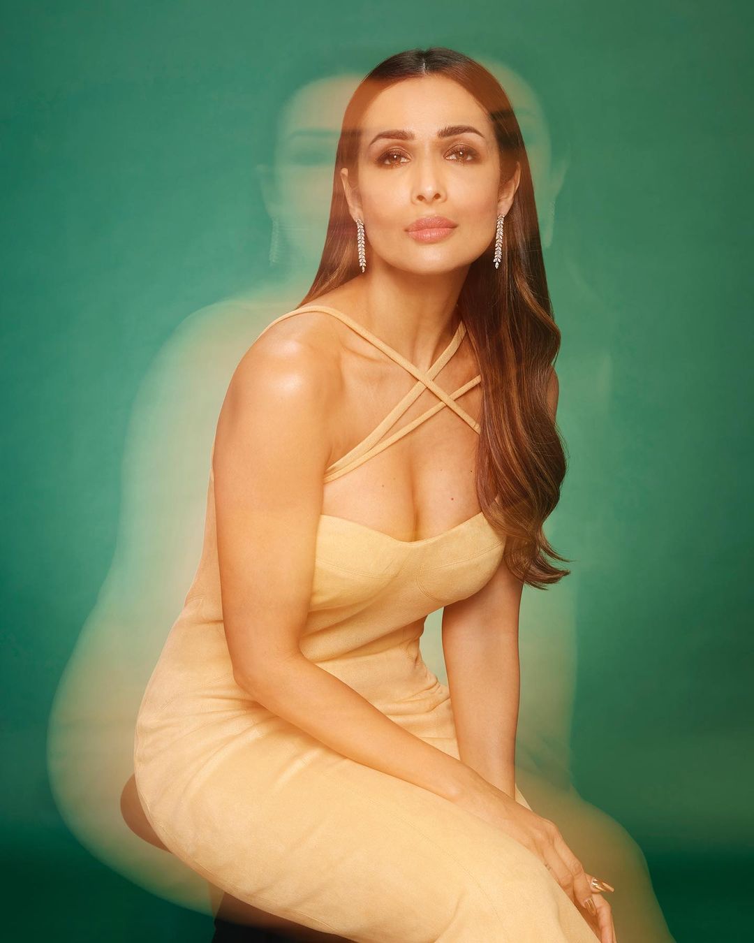 Malaika Arora looks stunning in a cleavage-baring yellow dress in her latest photoshoot.