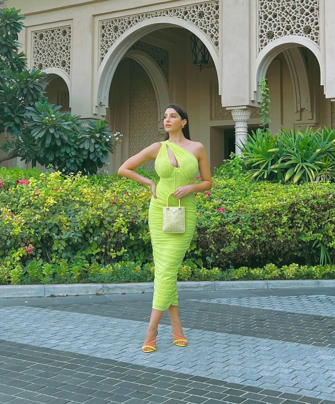 Nora Fatehi flaunts her hourglass figure in a neon green bodycon dress