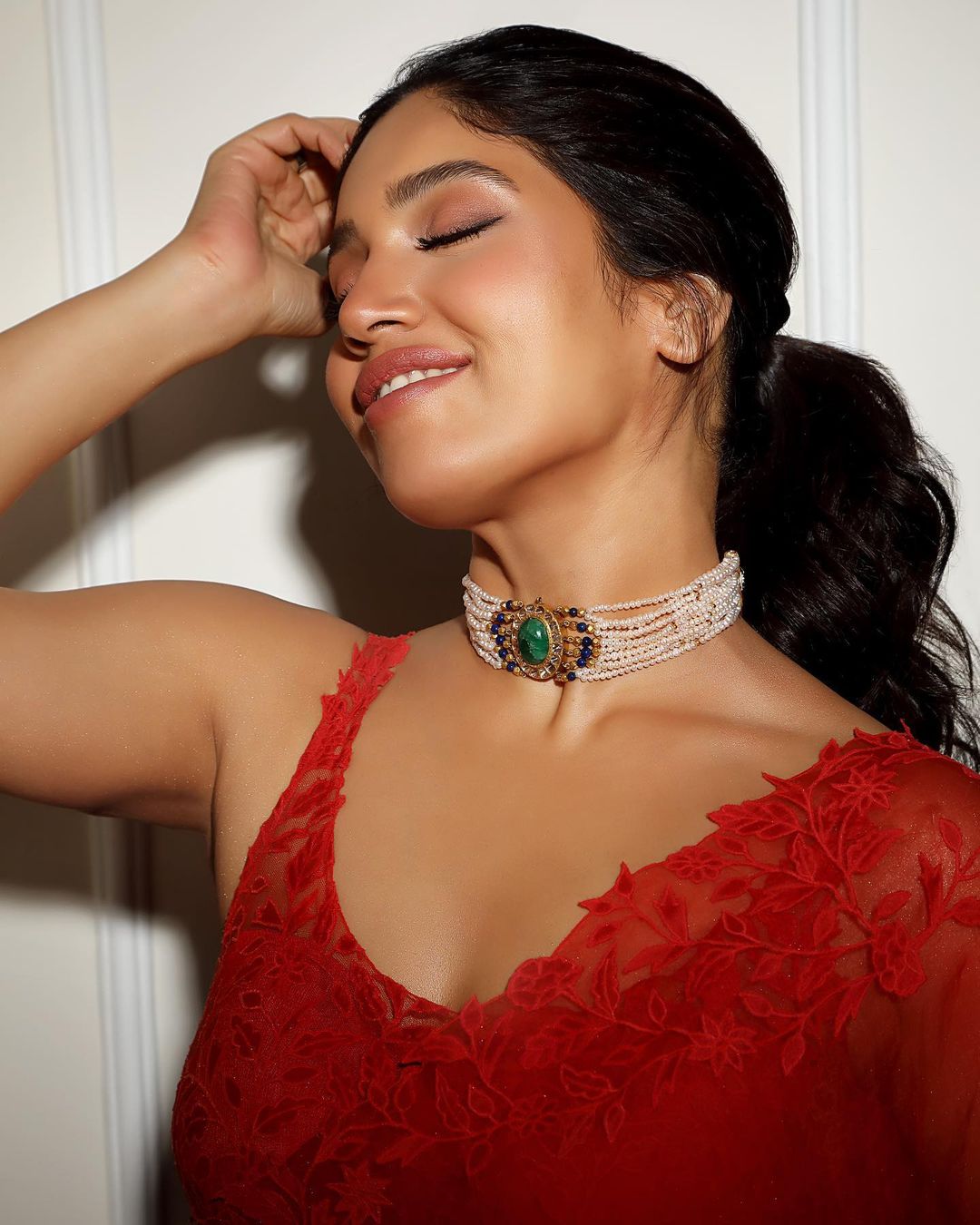 Bhumi Pednekar accessorises her look with a pearl choker.