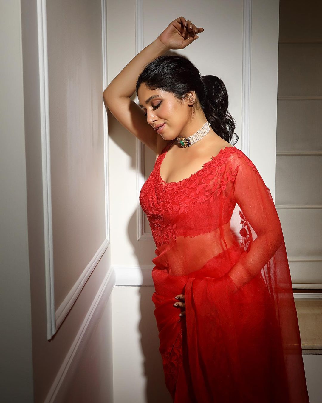Bhumi Pednekar exudes elegance in the see-through saree and matching blouse.