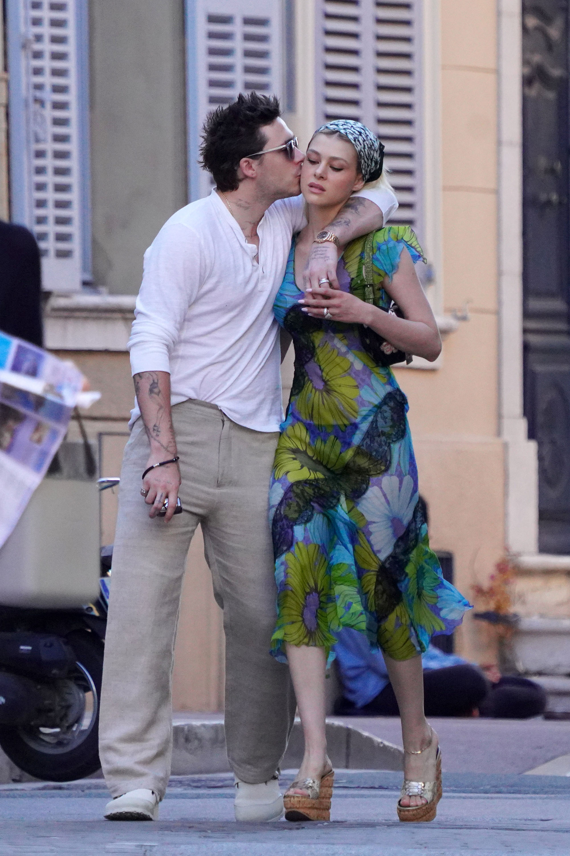Brooklyn Beckham gives wife Nicola Peltz a big smooch as they vacation in St. Tropez