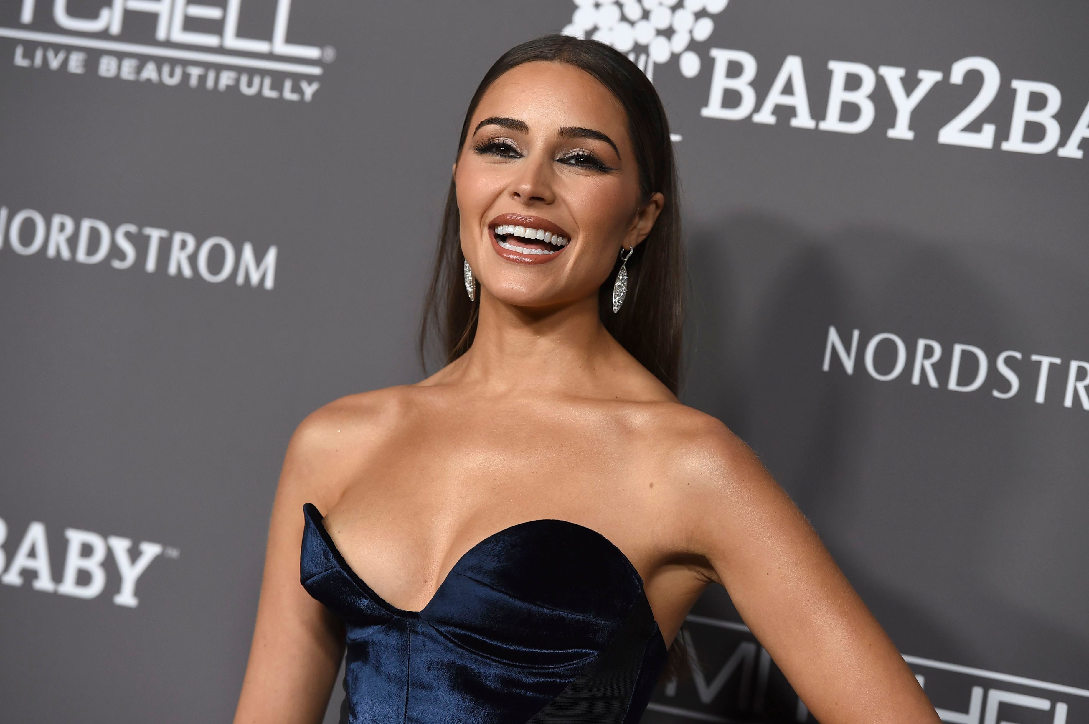 The brunette beautyâ€™s assets nearly fell out of the top of her navy blue gown at the 2018 Baby2Baby Gala.