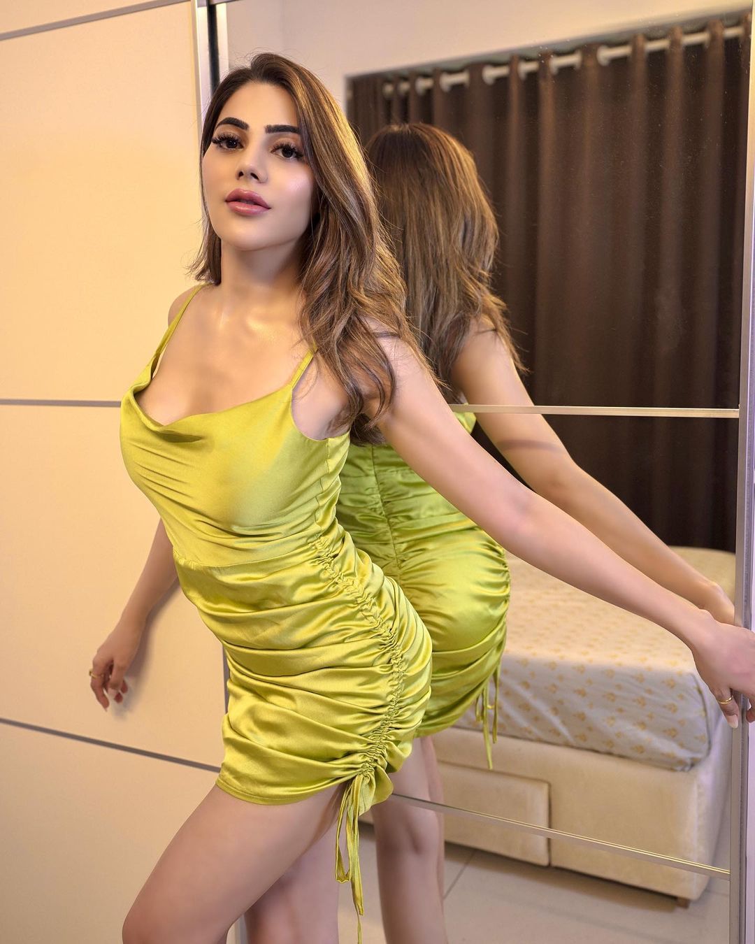 Nikki Tamboli looks hot in the green ruched dress