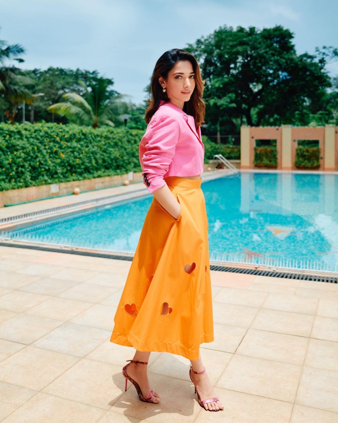 Tamannaah Bhatia looks delightful in a pink mini blazer with an orange midi skirt