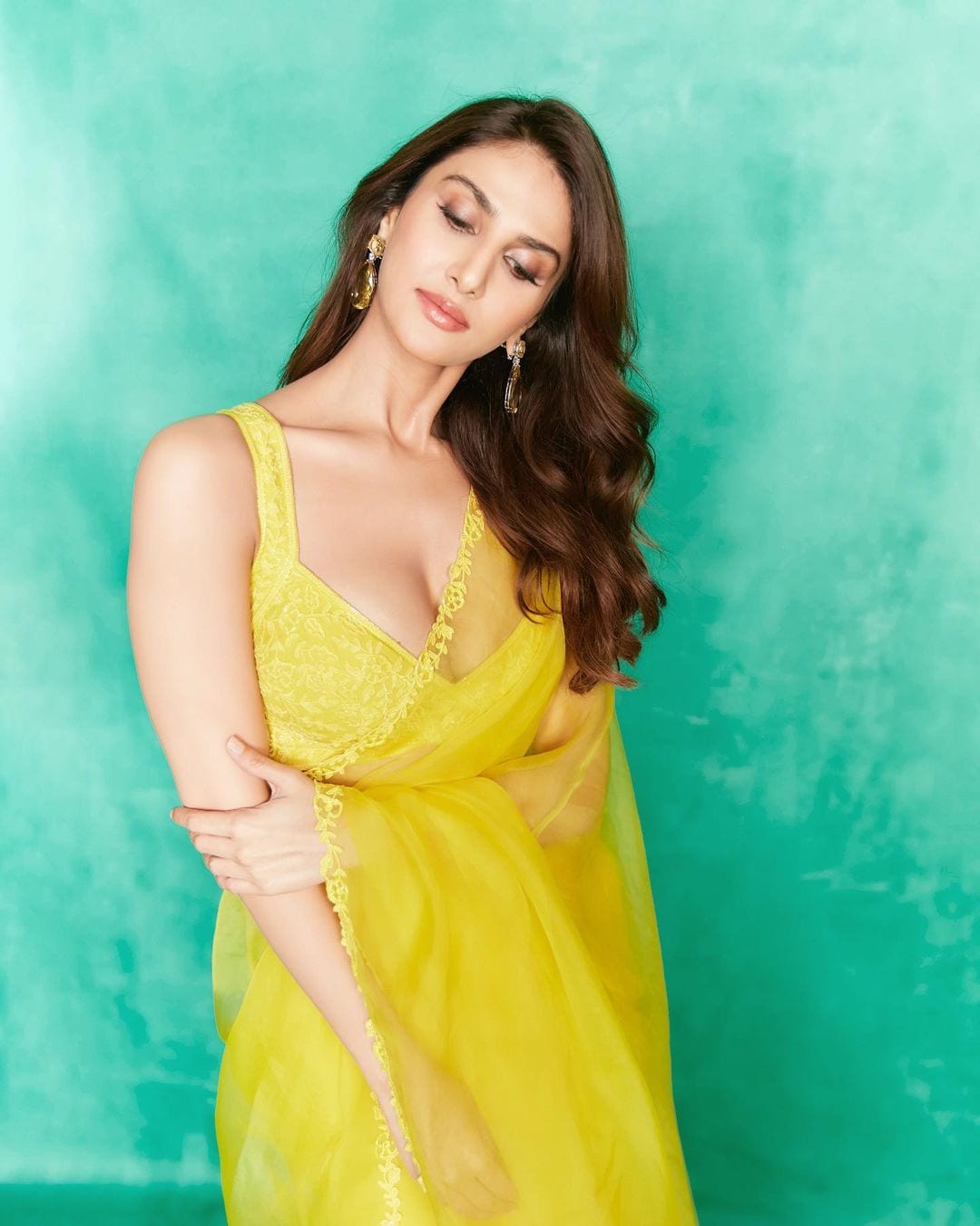 The actor looked all bright and happy in this picture where she donned a sheer yellow saree. She also gave some subtle poses, making it look quite dreamy