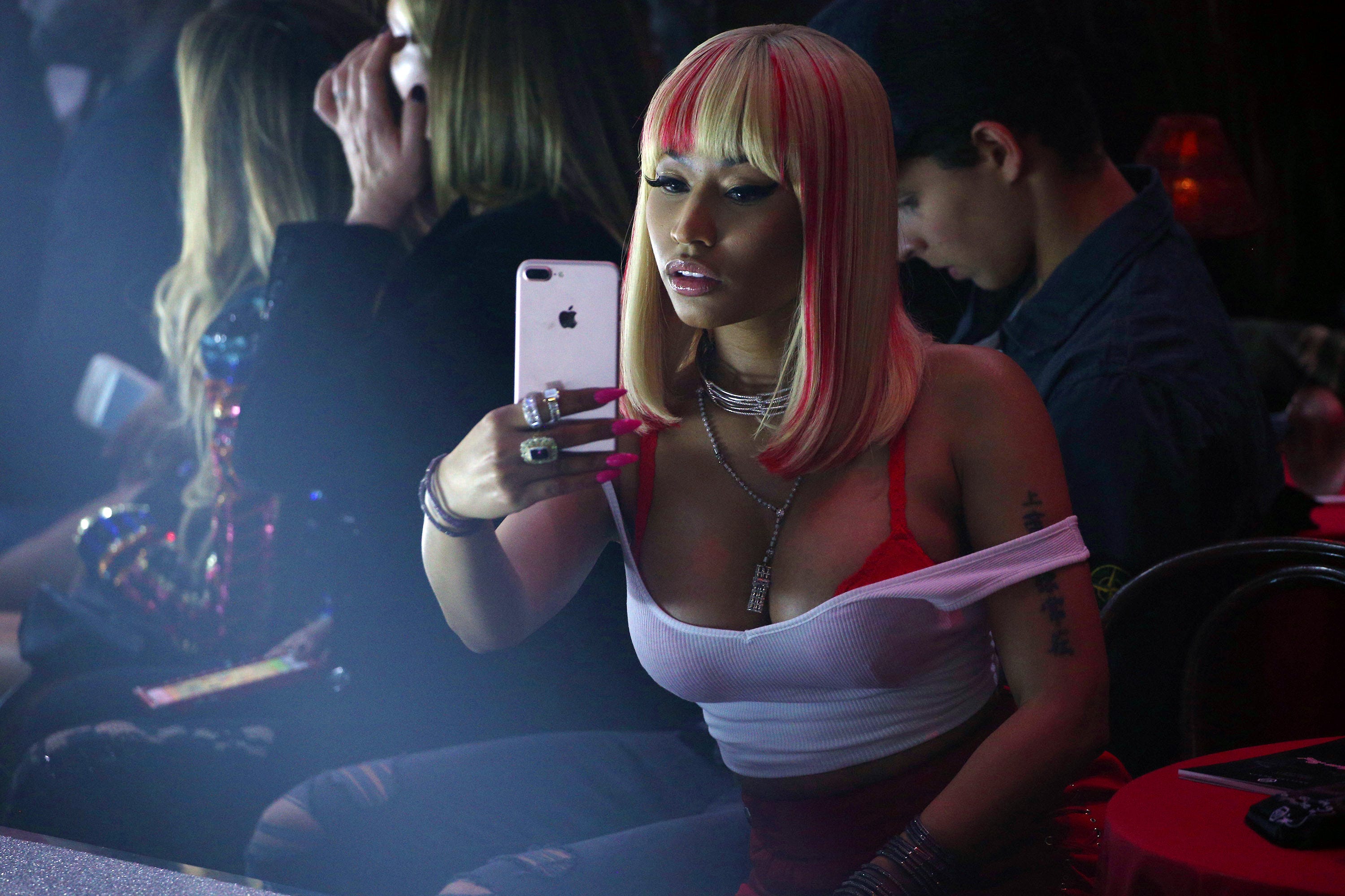 Nicki Minaj takes selfies for social media at the Philipp Plein Spring/Summer 2018 collection fashion show during New York fashion week
