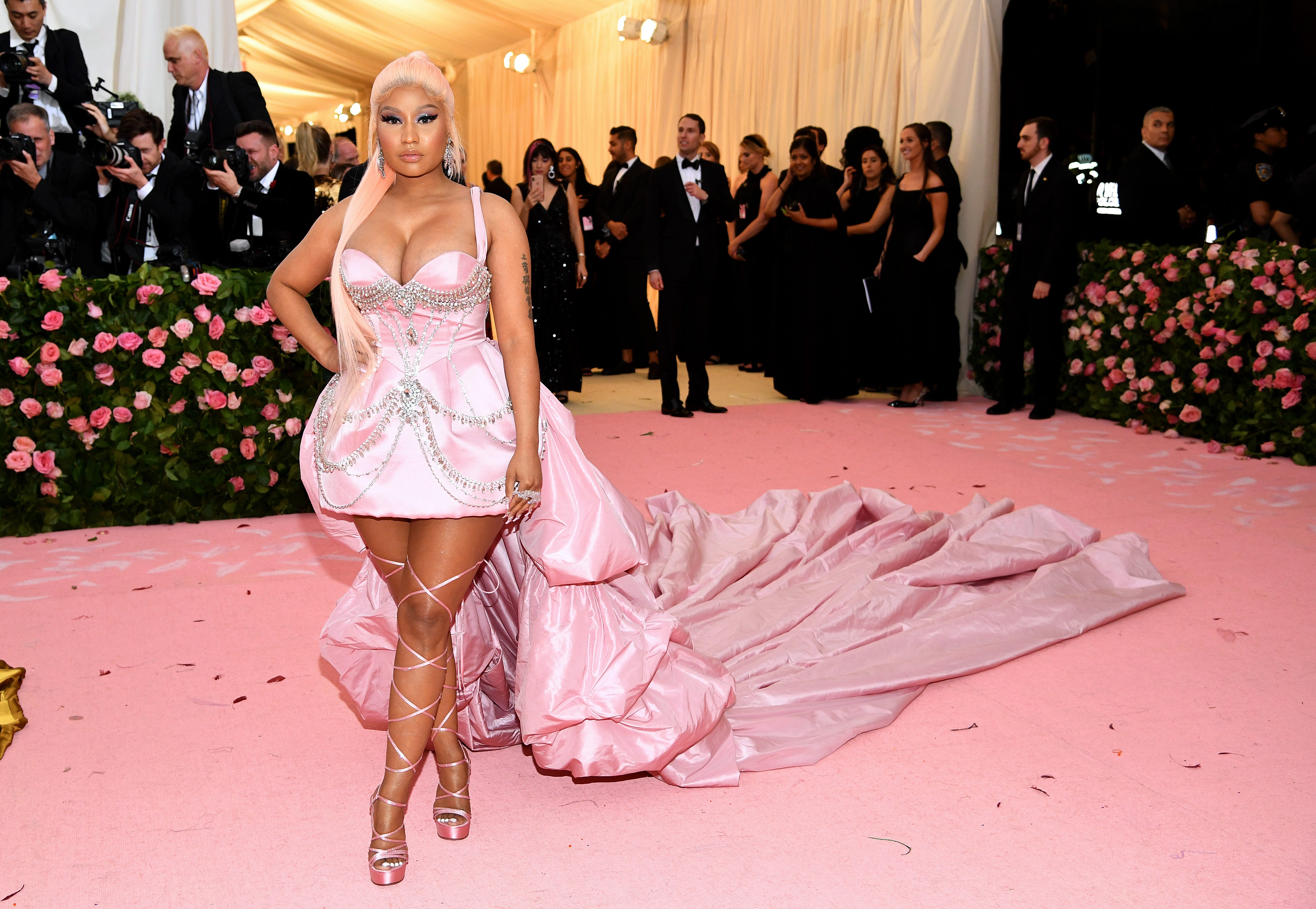 Nicki Minaj works the runway in an elegant pink train at the 2019 Met Gala 