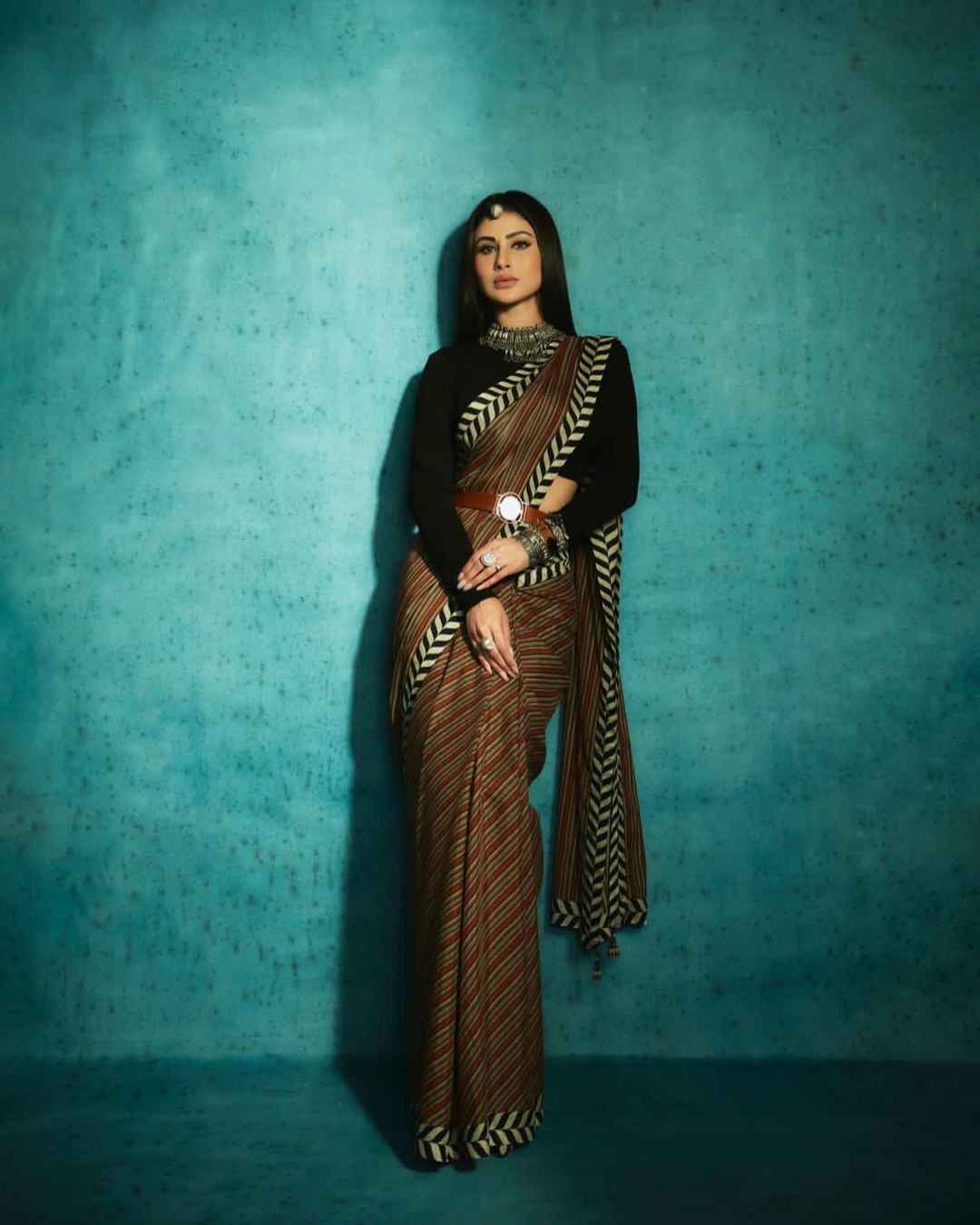 Mouni Roy looks elegant in the brown saree and black full-sleeve blouse