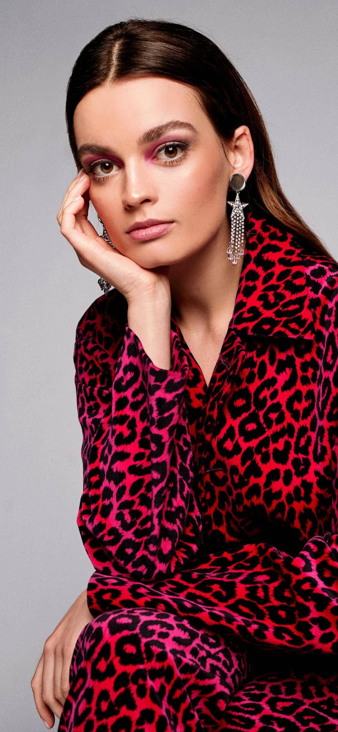 A Fashion Spread Featuring The Talented Emma Mackey Wearing A Loud Red Leopard Printed Suit