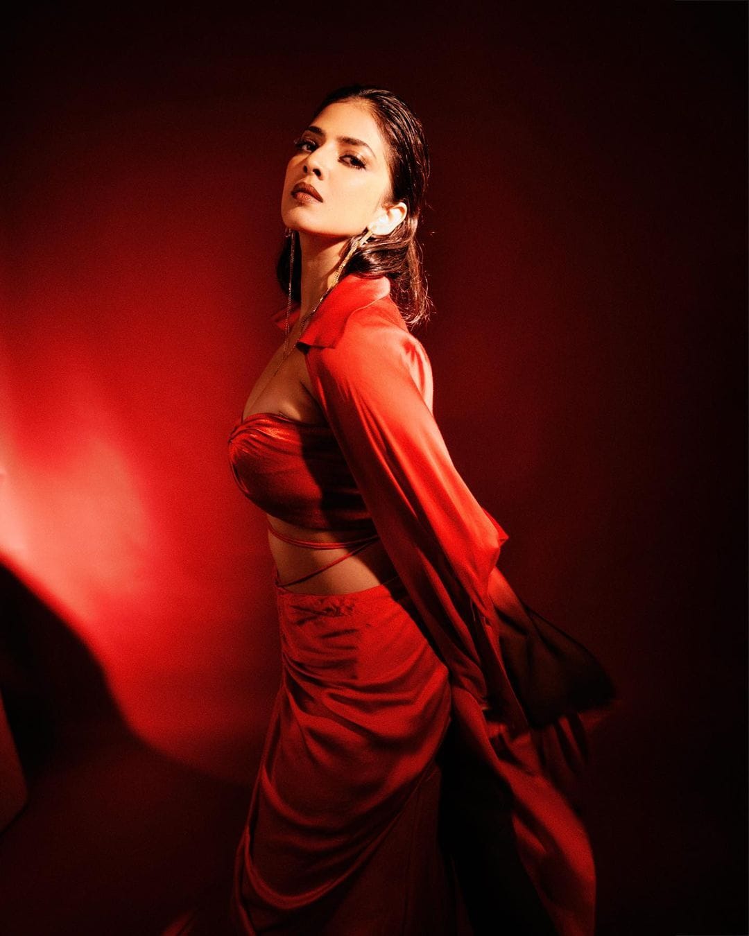 Malavika Mohanan looks scintillating in the red bralette, skirt and shirt