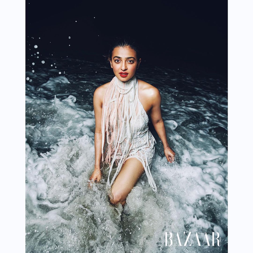 Radhika Apte is heating things up and how! Seen here in a white short dress frolicking in water.