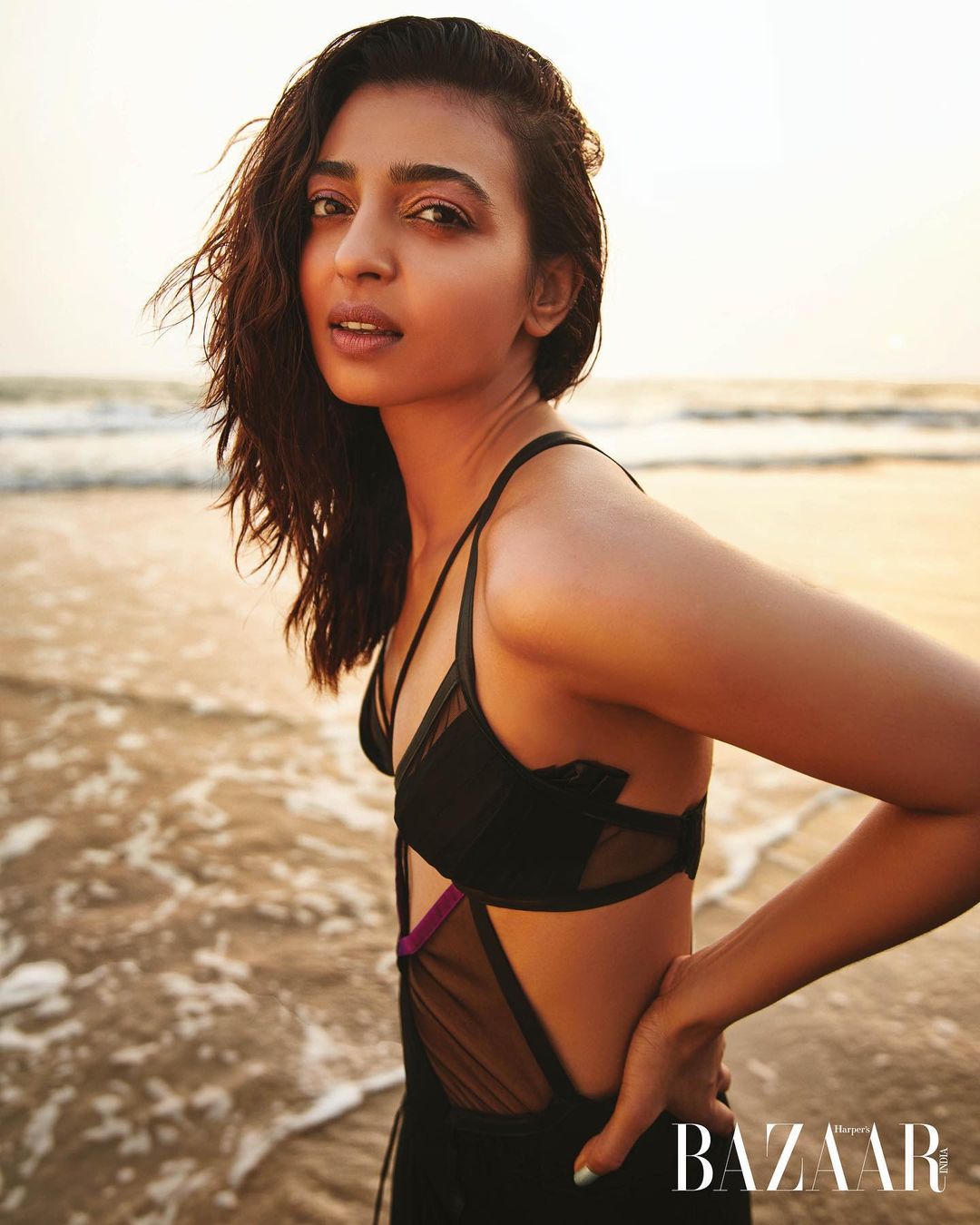 Radhika Apte looks hot in the black cutout swimwear.