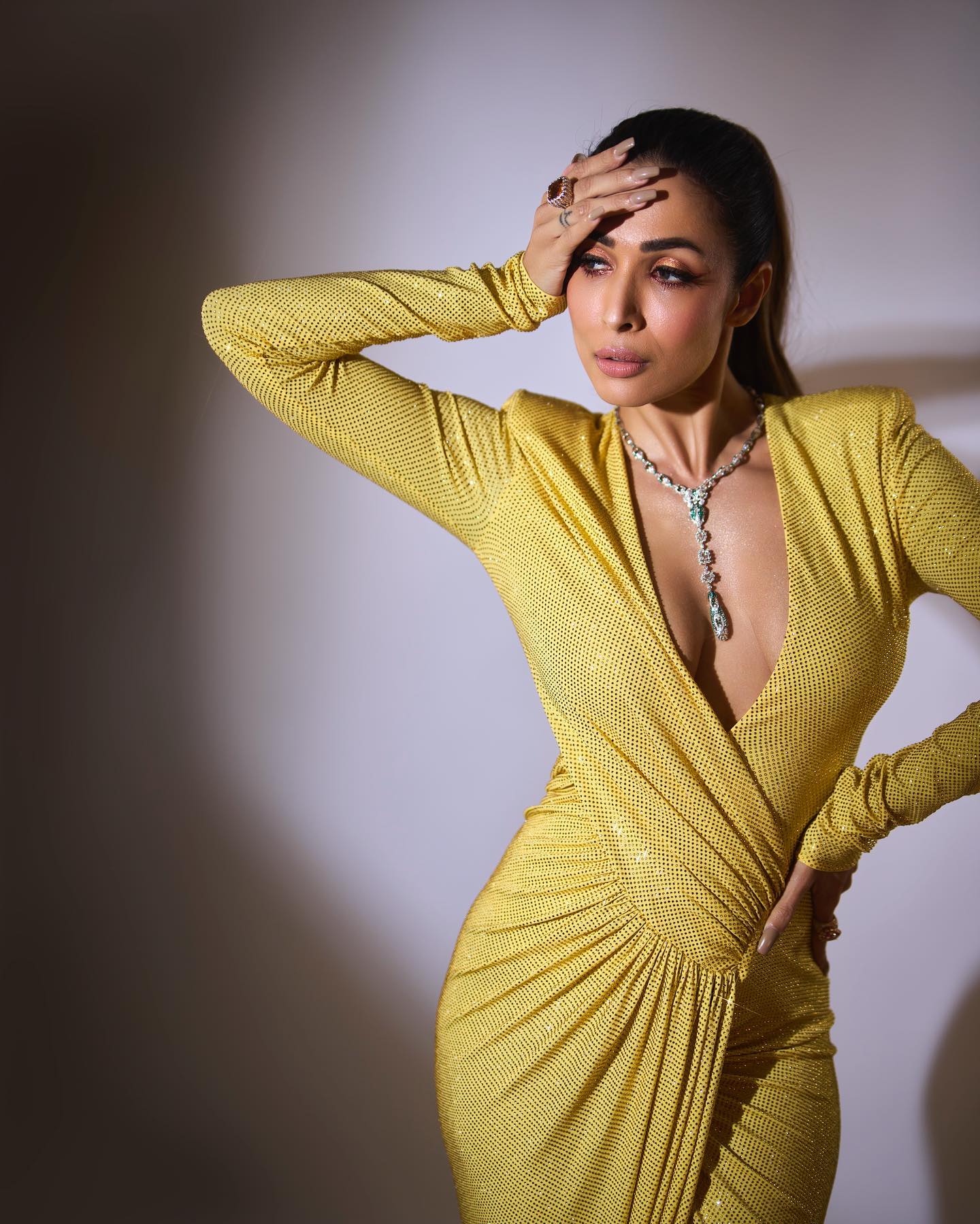 Malaika Arora made a dazzling appearance at the 2022 Filmfare Awards in a sexy cleavage-baring yellow dress