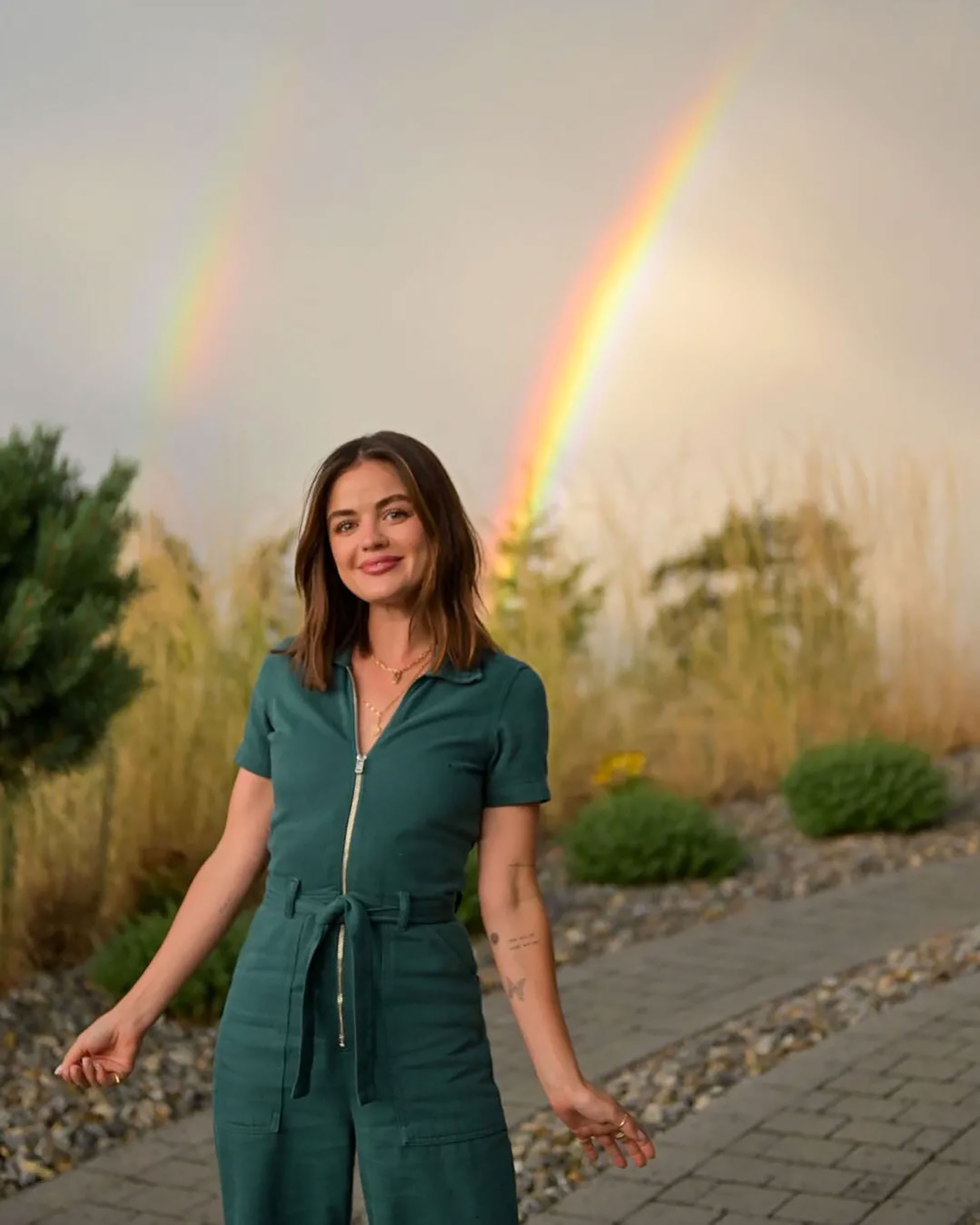 Lucy Hale says the gorgeous rainbow behind her spreads 