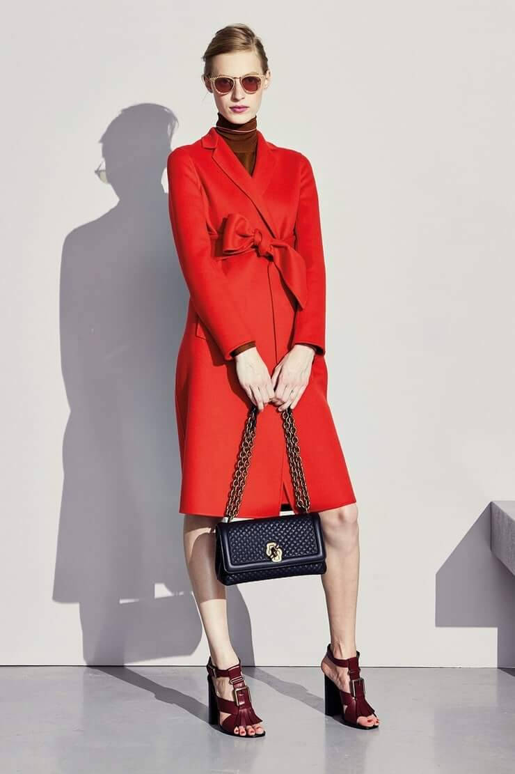 A Fashionable Look Of Model Julia Nobis As She Wore A Red Dress With Black Bag