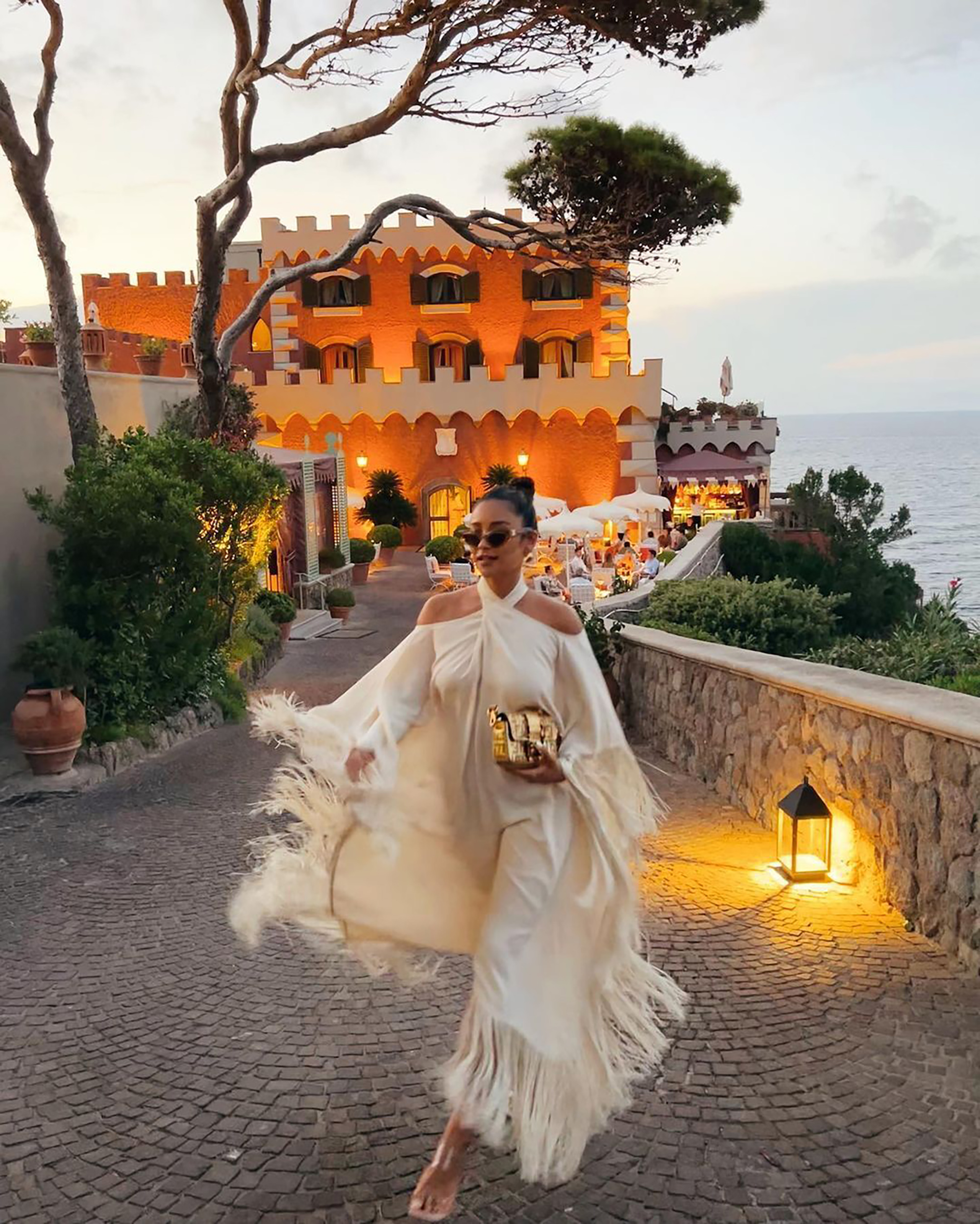 Shay Mitchell snaps a fashionable photo from an exotic locale.