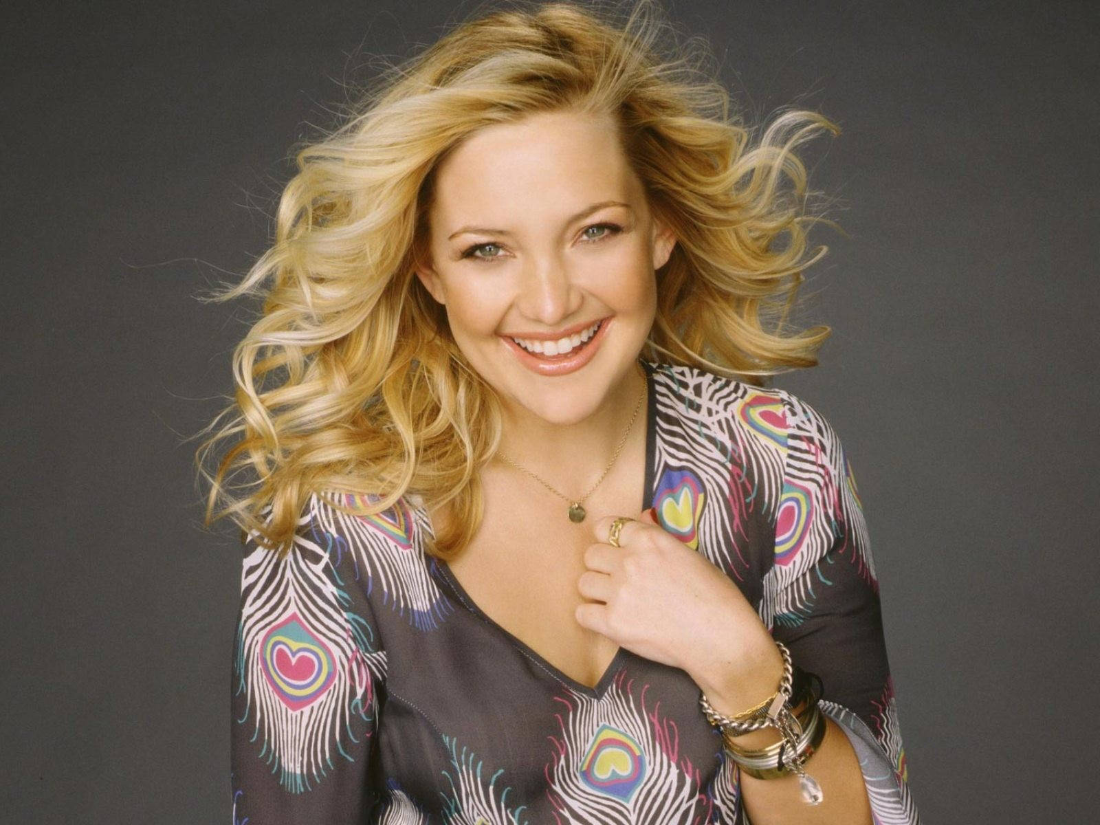 A Captivating Image Of American Celebrity Kate Hudson Splendidly Smiling At The Camera Inside The Studio