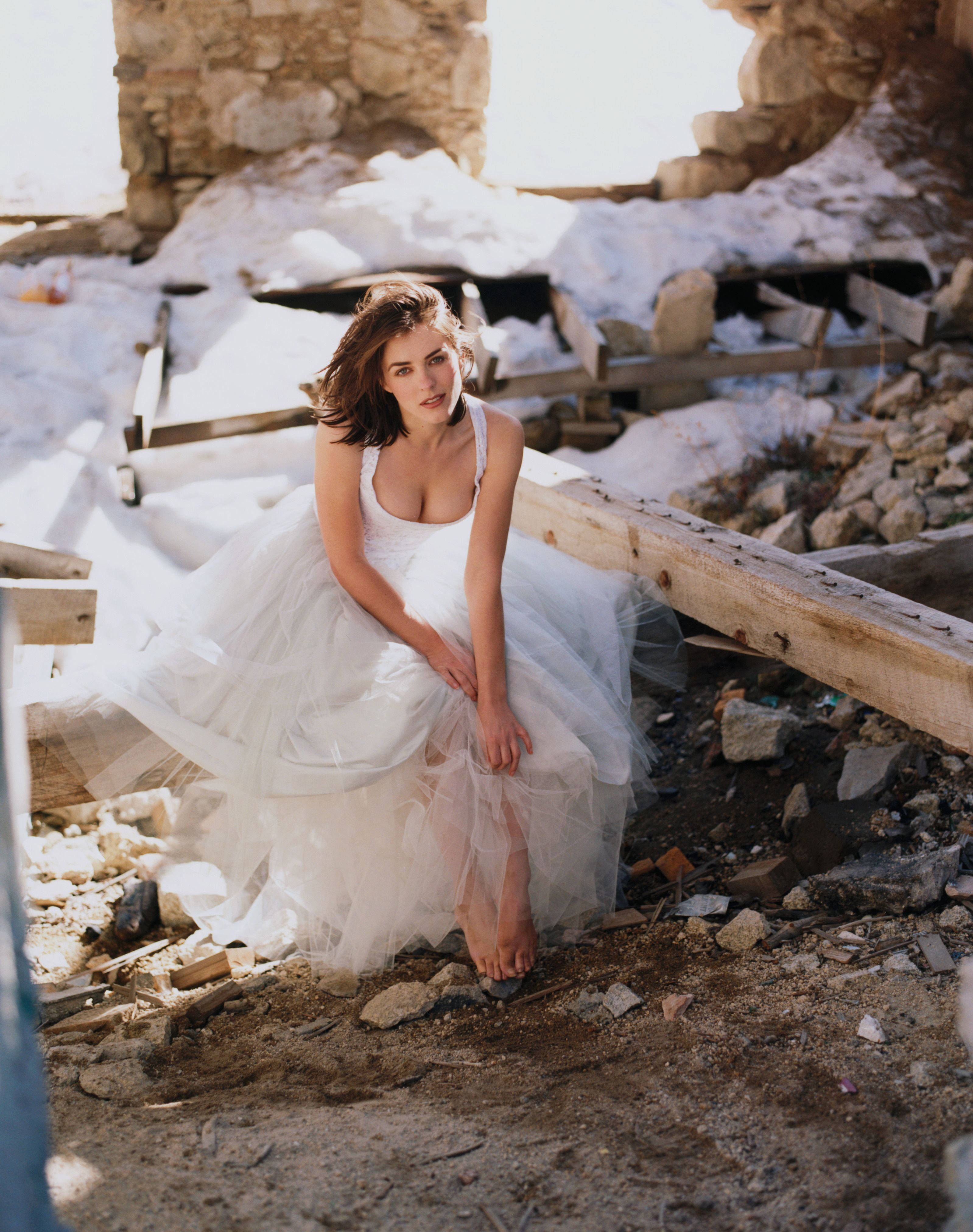 A Stupendous Look Of English Model Elizabeth Hurley Posing In A White Dress For A Photoshoot At The Ruins