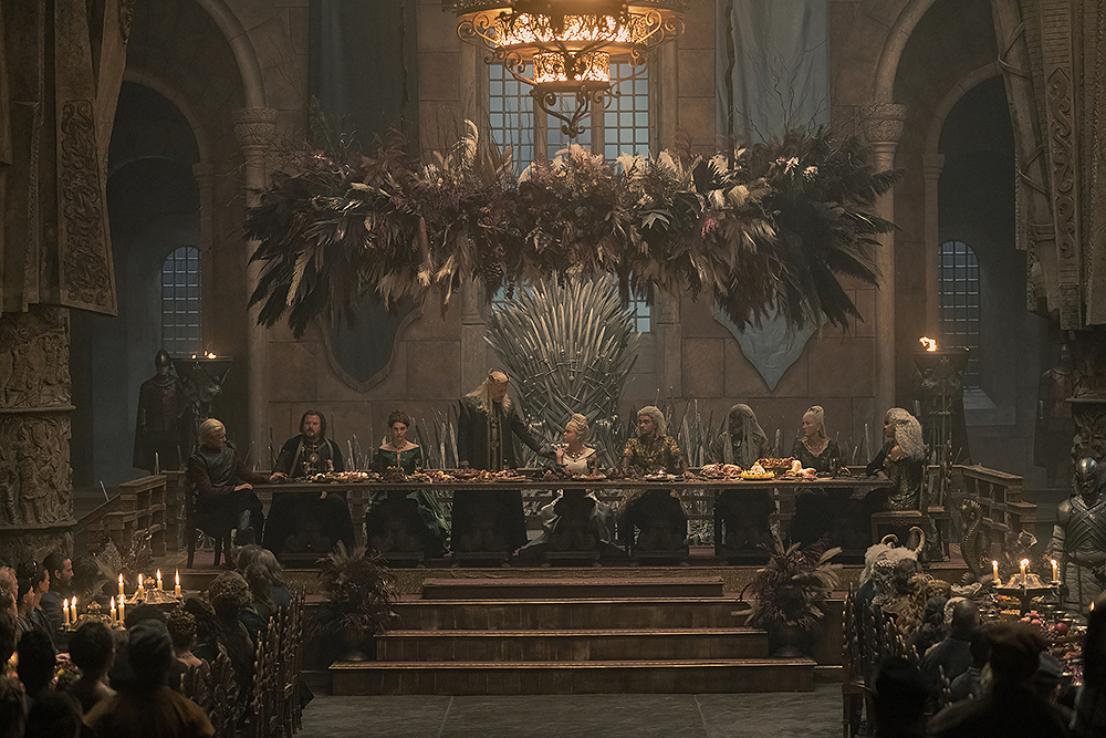 The King toasts Rhaenyra and Laenor in episode 5. Despite being cast out by his brother, you can spot Daemon on the left.