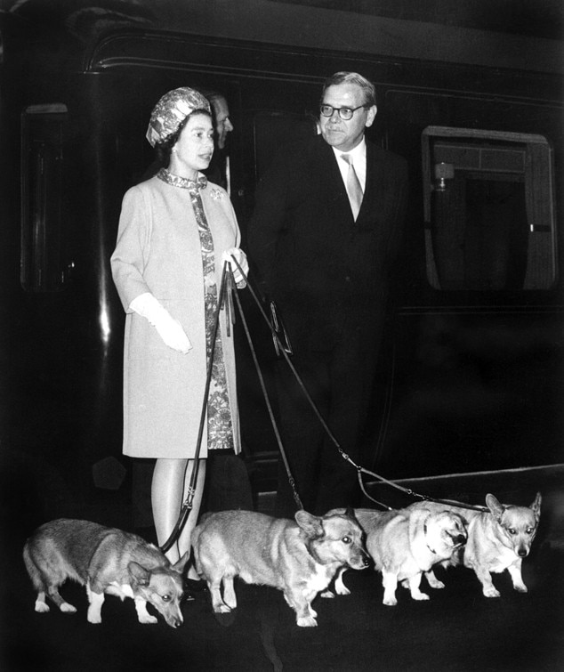 Queen Elizabeth II arrives at King's Cross station with her dogs on October 15, 1969