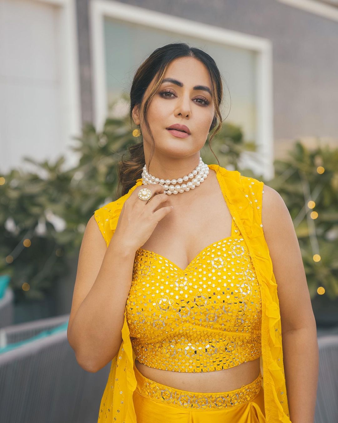 Hina Khan wears a three-tiered pearl choker to complete the look